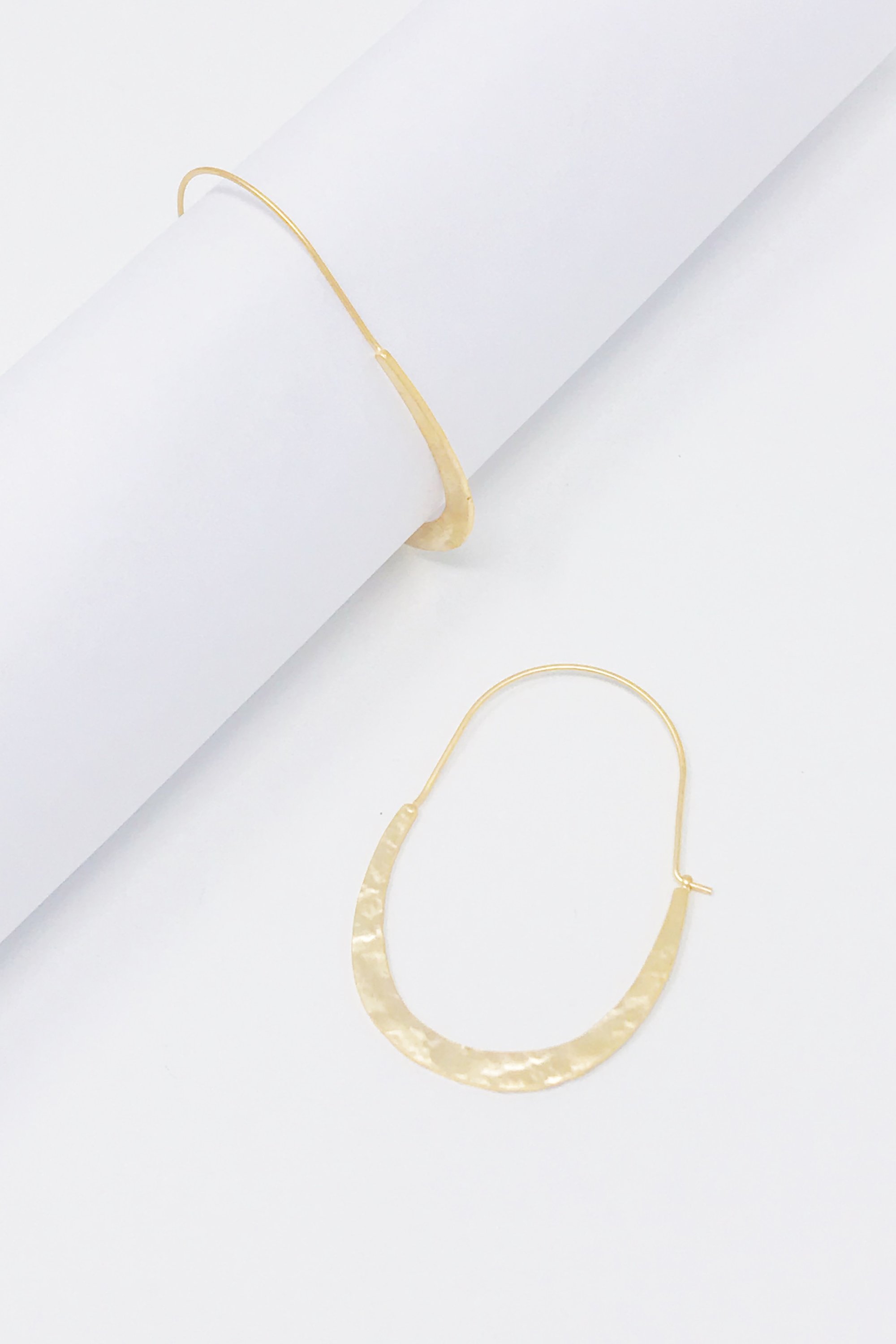 Crescent Hammered Hoop Earrings featuring a unique hammered texture and elegant crescent shape.