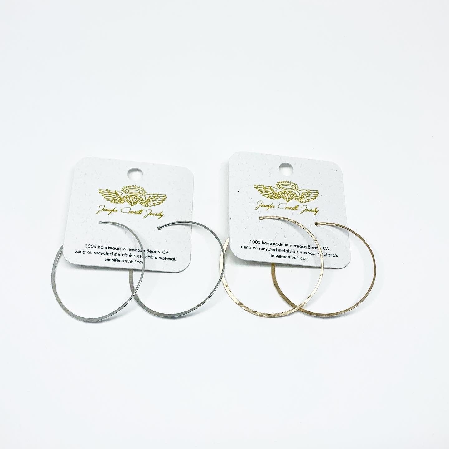 Elegant crescent moon hoop earrings in various sizes and finishes, showcasing a hammered texture and organic curves.