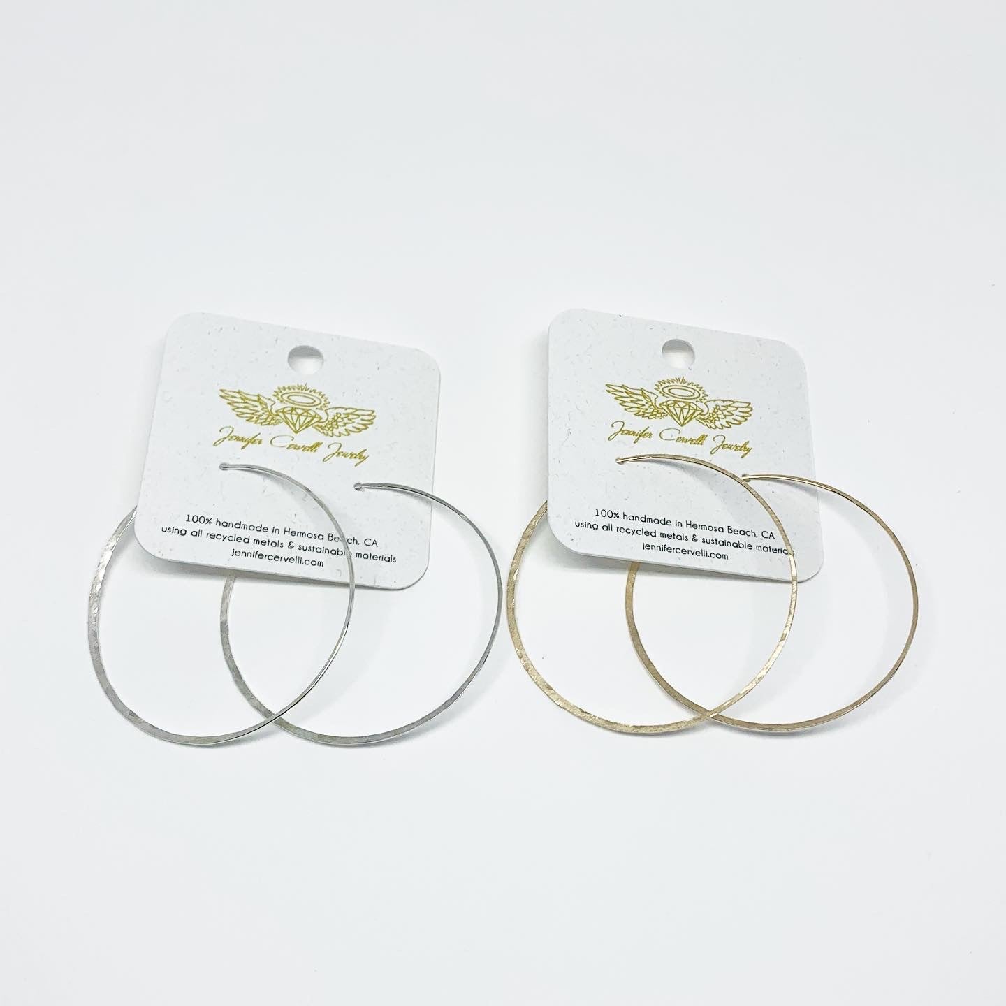 Elegant crescent moon hoop earrings in various sizes and finishes, showcasing a hammered texture and organic curves.