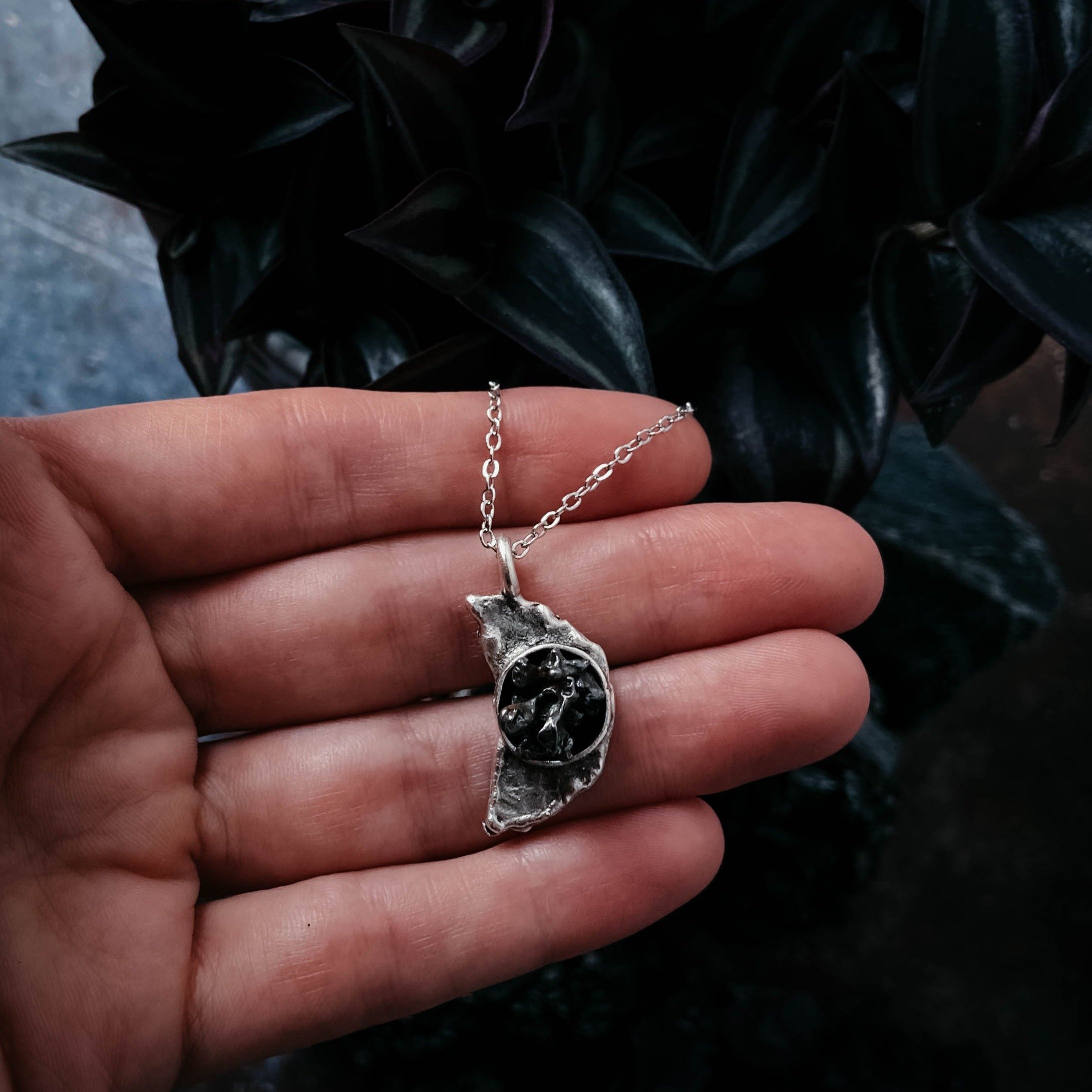 Crescent Moon Necklace featuring authentic Campo del Cielo meteorite with a hammered finish, elegantly displayed on a soft background.