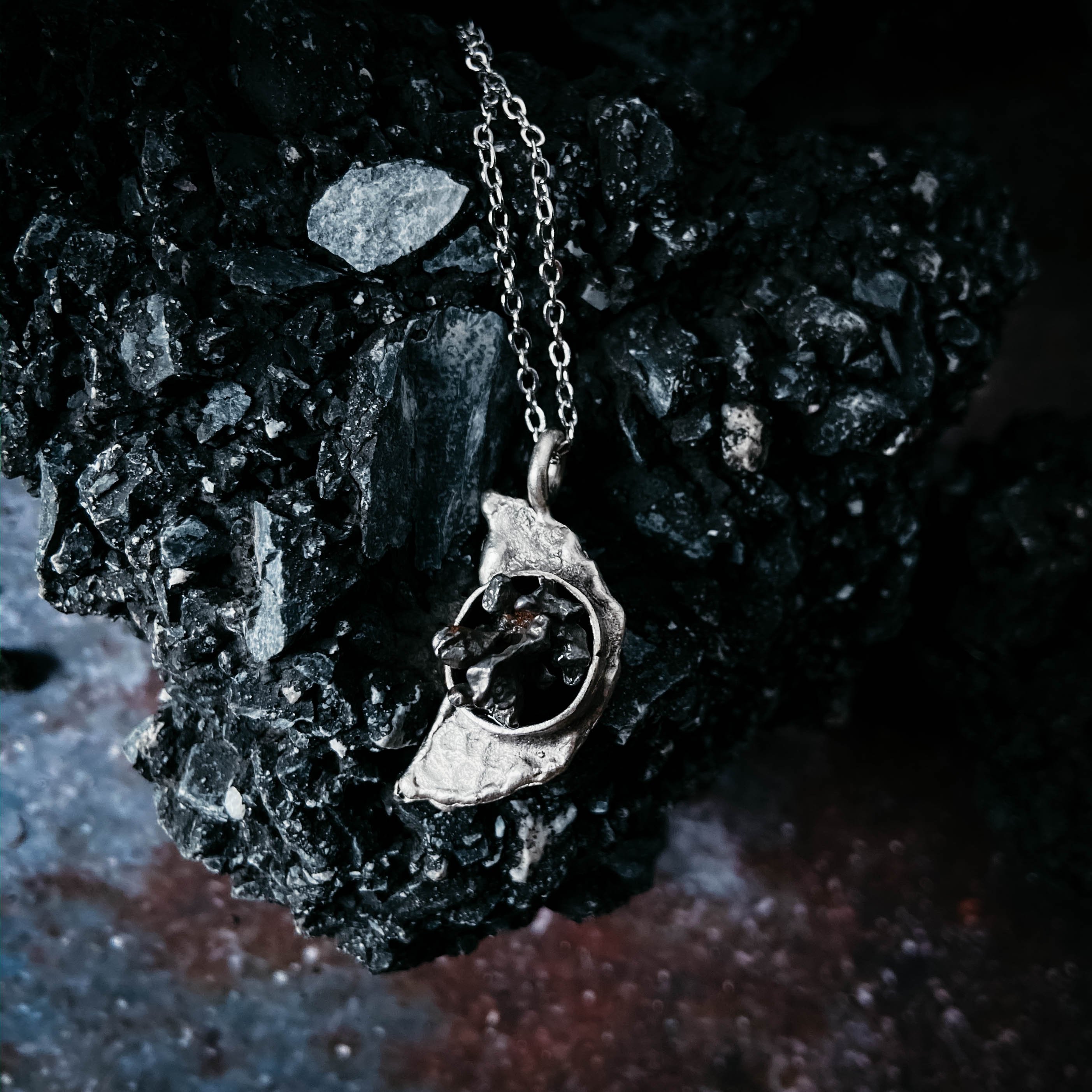 Crescent Moon Necklace featuring authentic Campo del Cielo meteorite with a hammered finish, elegantly displayed on a soft background.