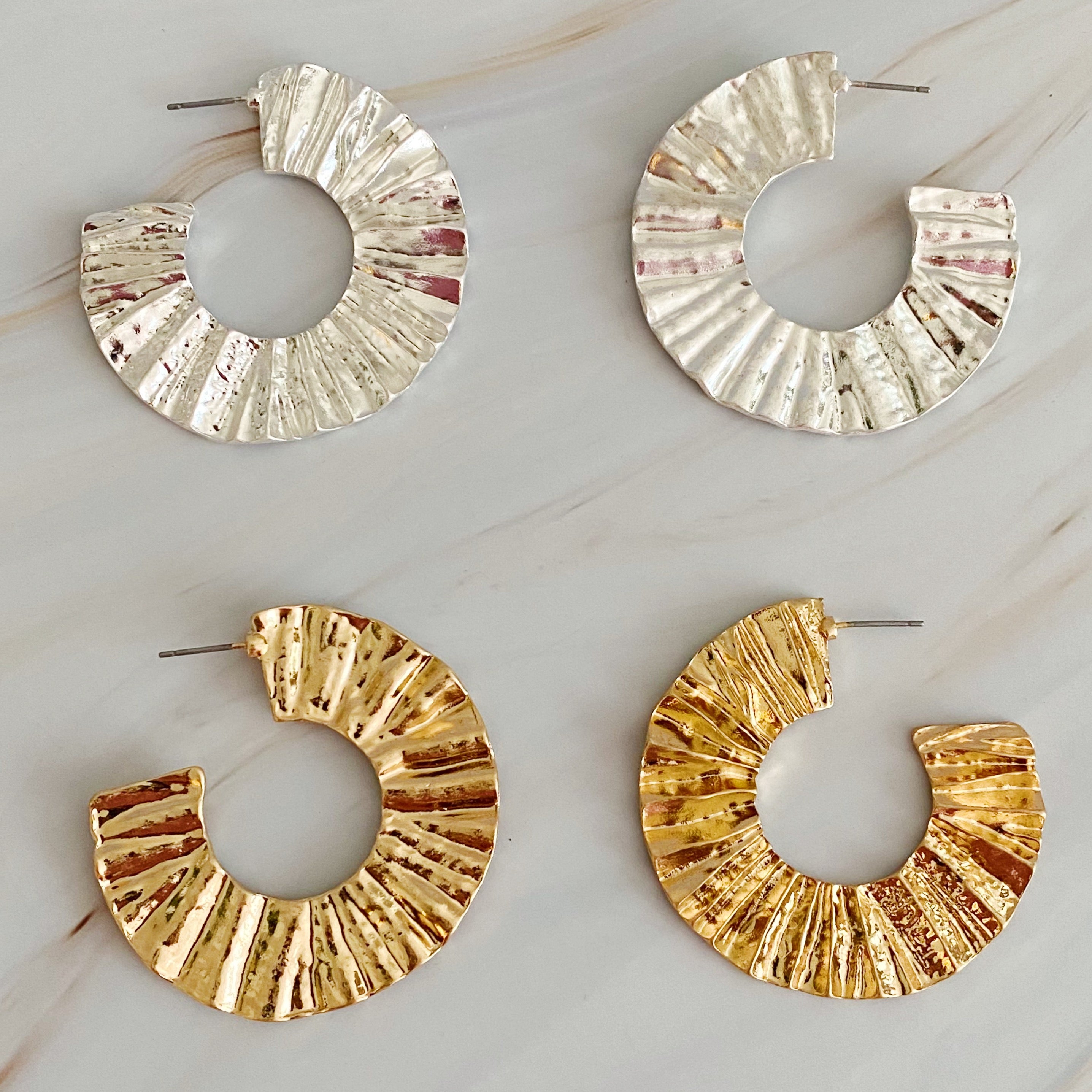 A pair of Crinkled Art Hoop Earrings showcasing a unique crinkled design in a plated alloy metal finish.