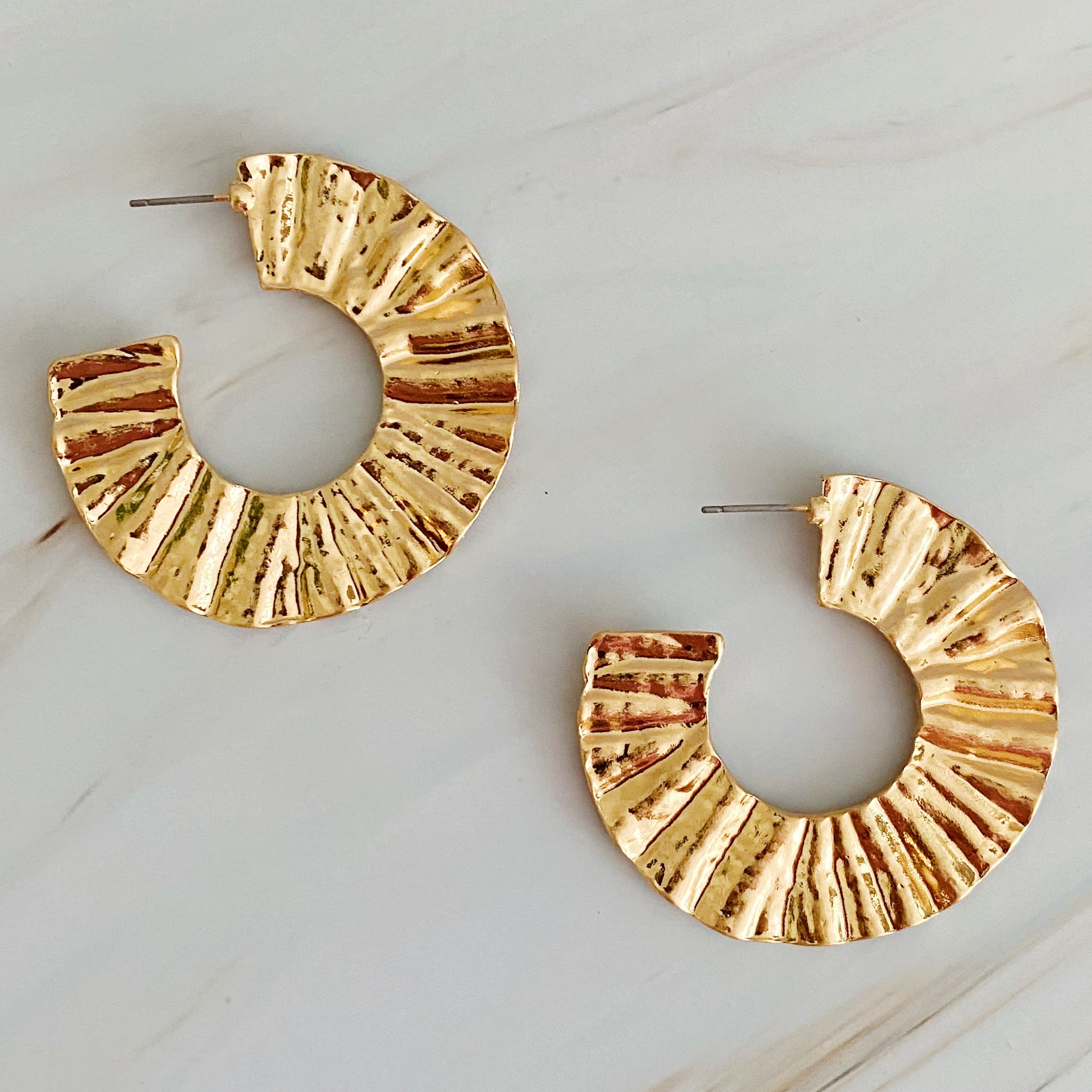 A pair of Crinkled Art Hoop Earrings showcasing a unique crinkled design in a plated alloy metal finish.