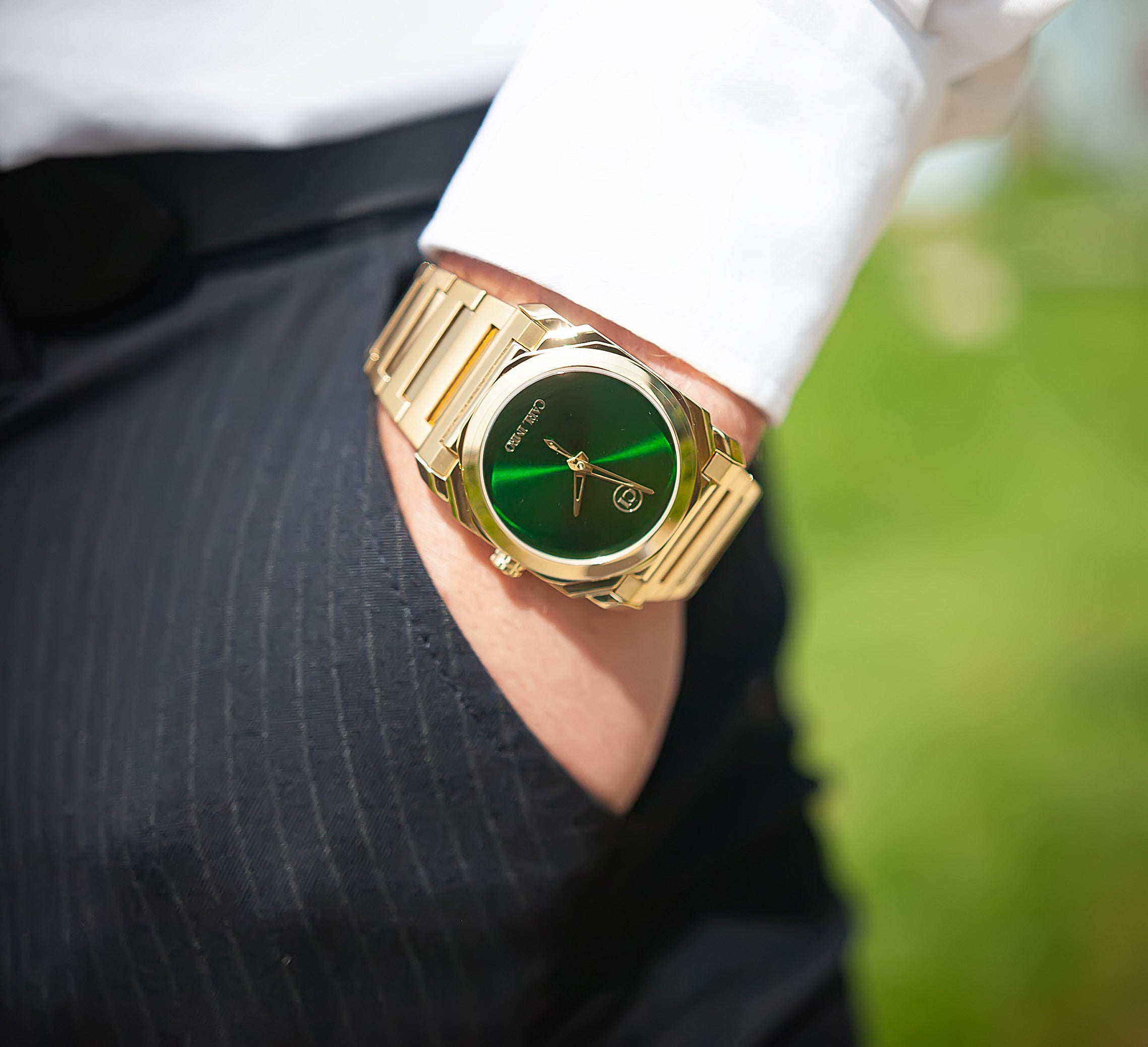 CRLi Brazo Liso OR Men's Watch featuring an alloy case with IP gold/silver plating, sapphire glass, and a black/green sunray dial.