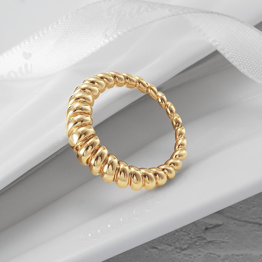 Elegant Croissant Ring made of 316L surgical stainless steel with 14K gold PVD plating, showcasing its unique design and luxurious finish.