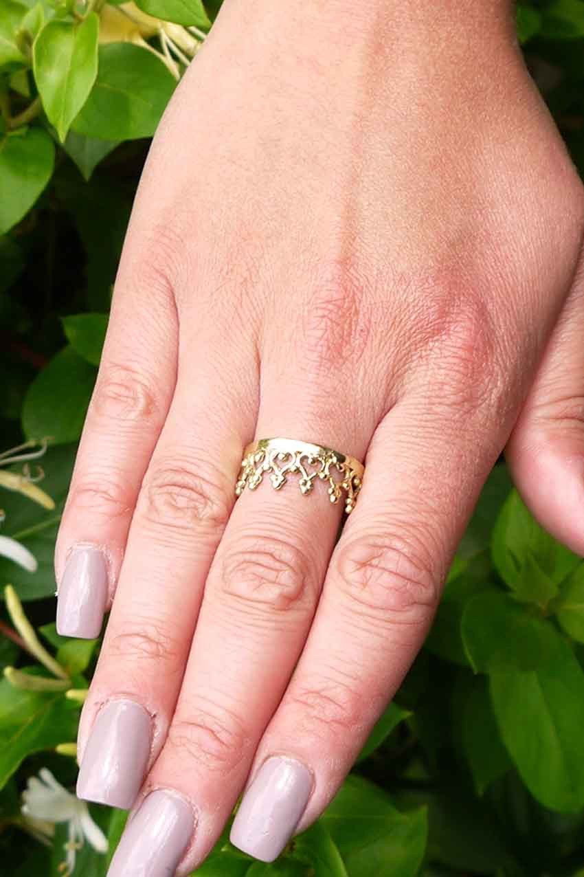 A stunning brass Crown Ring with a simplistic crown design, perfect for stacking and showcasing elegance.