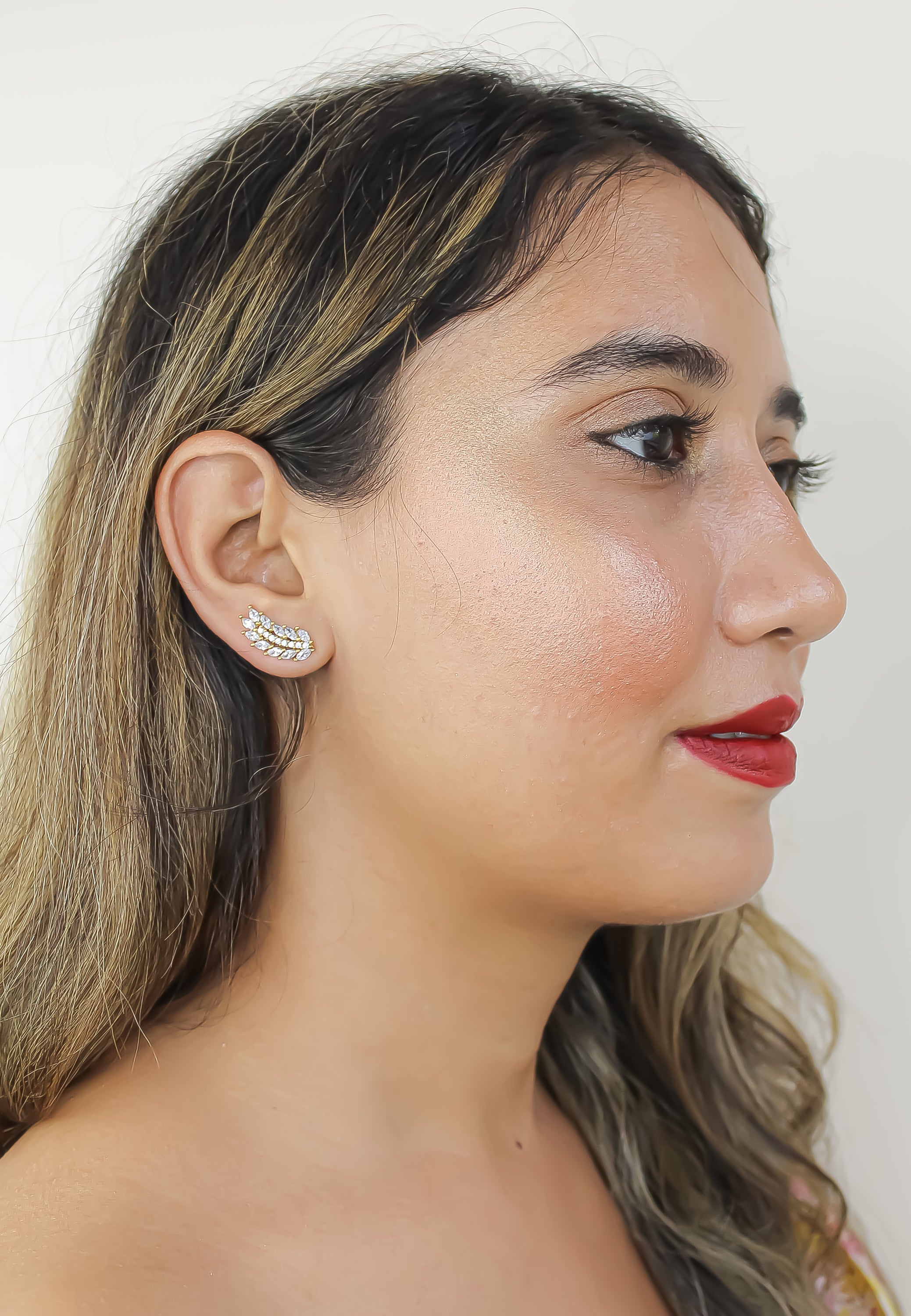 Elegant Cruise Wings Earrings featuring 18K gold plating and 19 sparkling zirconia stones, designed for sensitive ears.