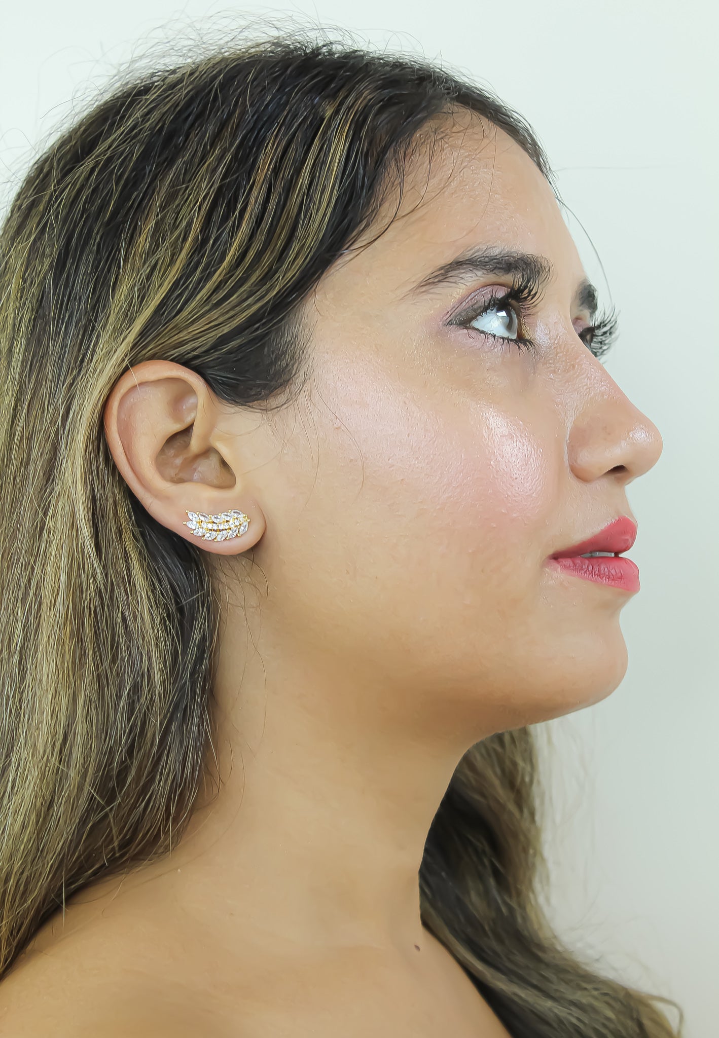 Elegant Cruise Wings Earrings featuring 18K gold plating and 19 sparkling zirconia stones, designed for sensitive ears.