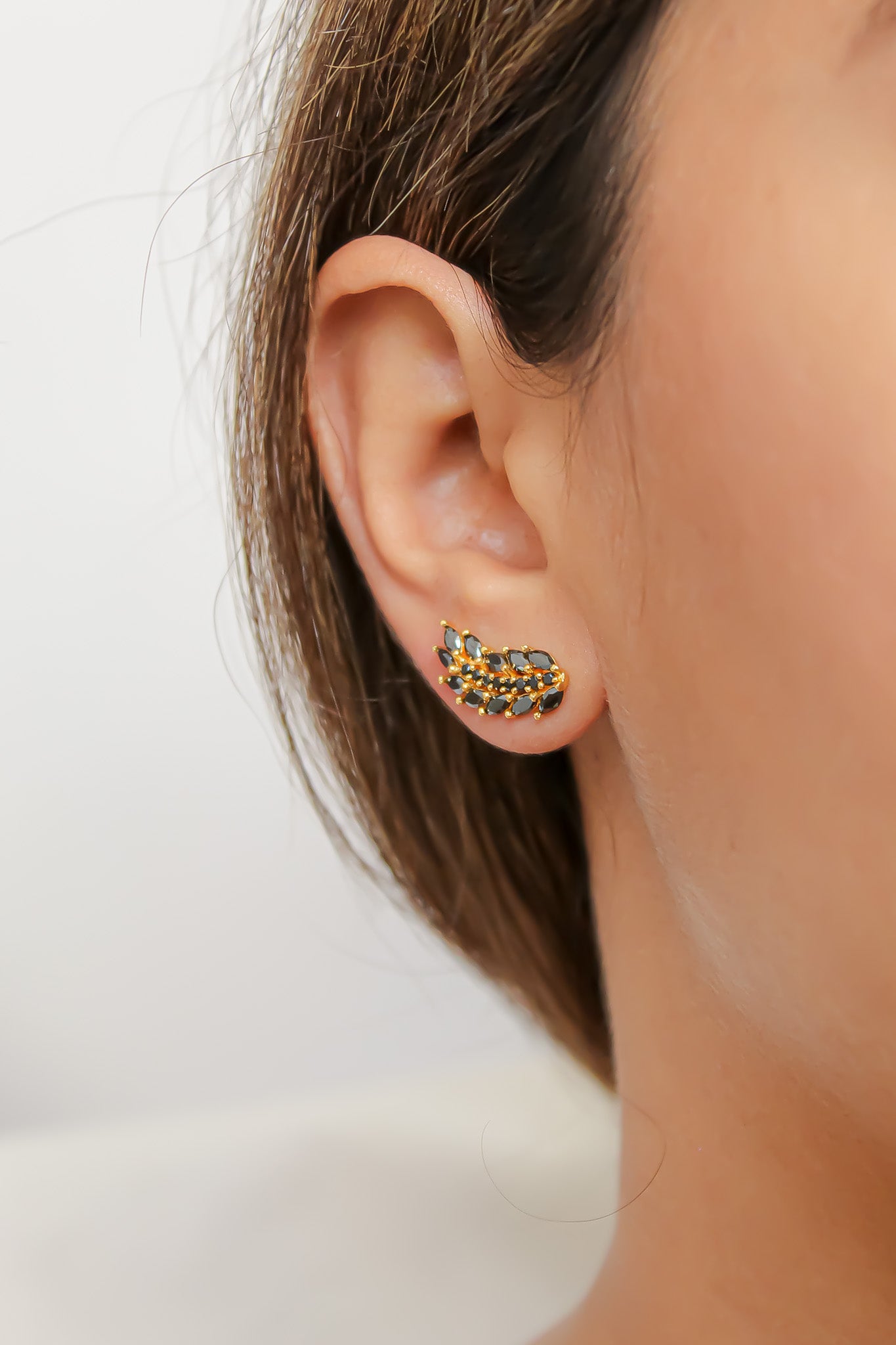 Elegant Cruise Wings Earrings featuring 18K gold plating and 19 sparkling zirconia stones, designed for sensitive ears.