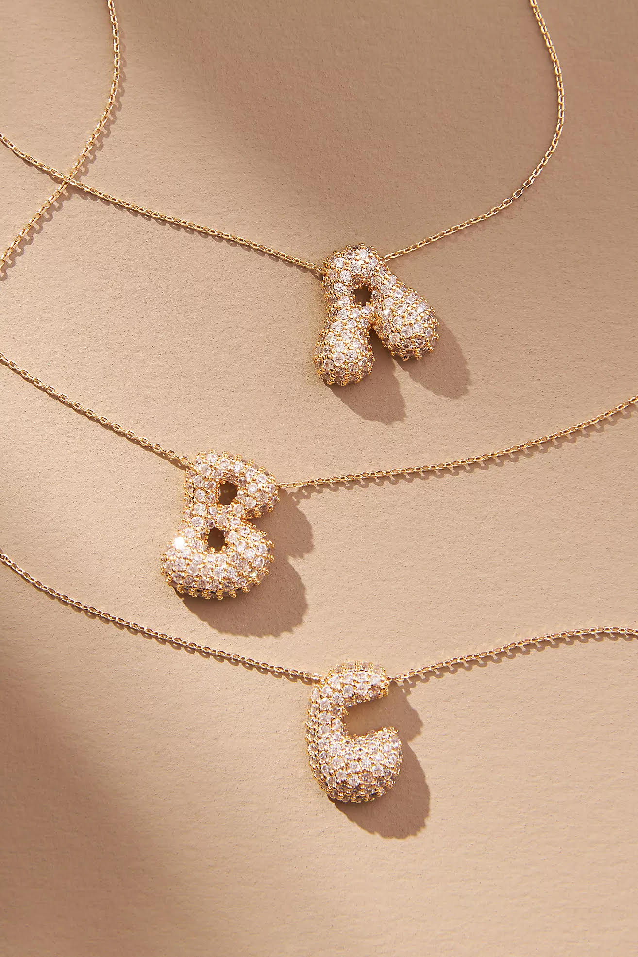 Elegant Crystal Bubble Initial Necklace in 18k gold plating with customizable charm.