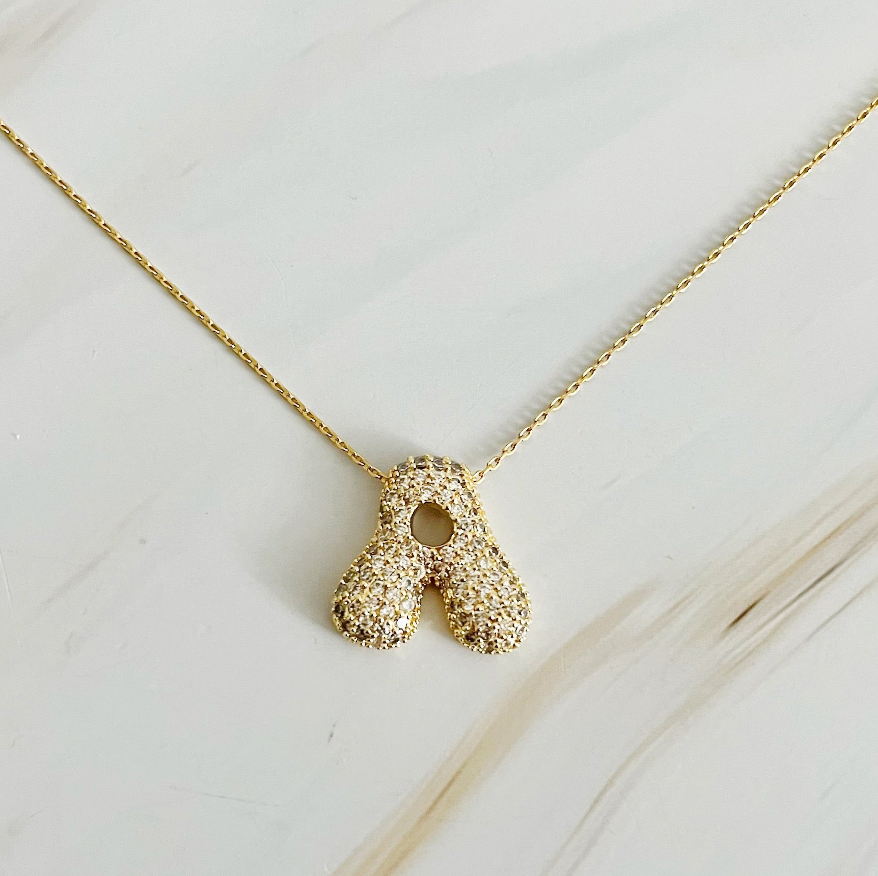 Elegant Crystal Bubble Initial Necklace in 18k gold plating with customizable charm.