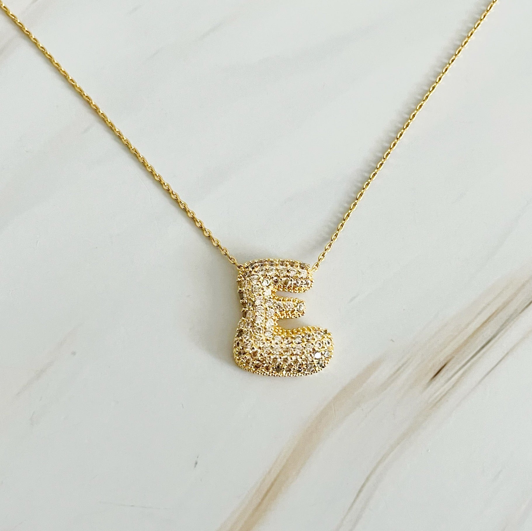 Elegant Crystal Bubble Initial Necklace in 18k gold plating with customizable charm.