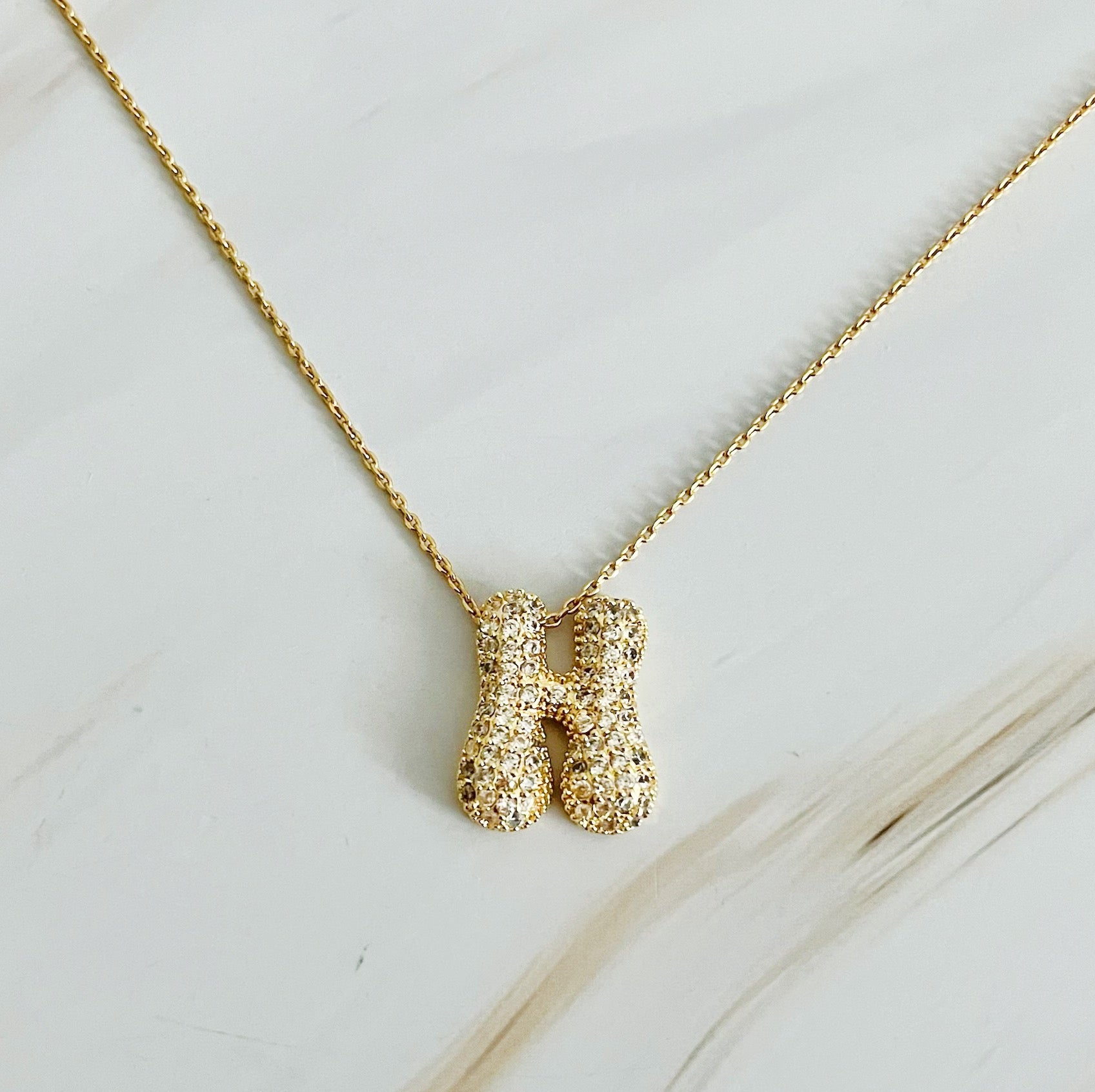 Elegant Crystal Bubble Initial Necklace in 18k gold plating with customizable charm.