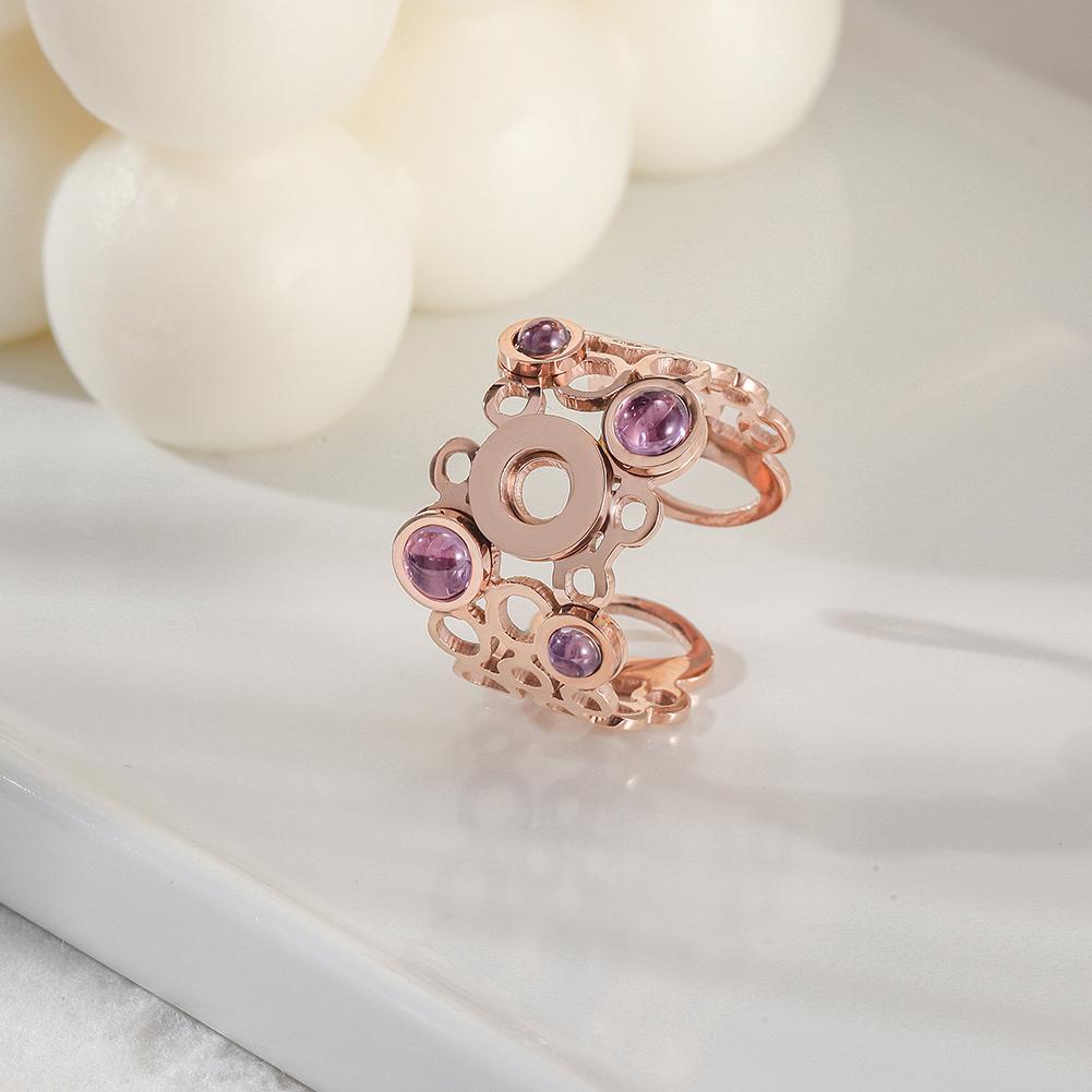 Elegant Crystal Circle Ring featuring interconnected circles and four purple pearls, perfect for any occasion.