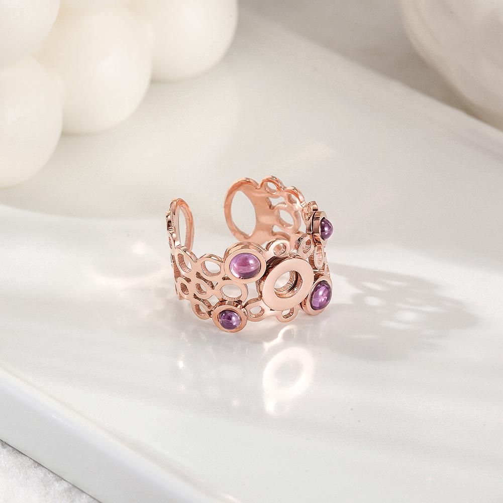 Elegant Crystal Circle Ring featuring interconnected circles and four purple pearls, perfect for any occasion.