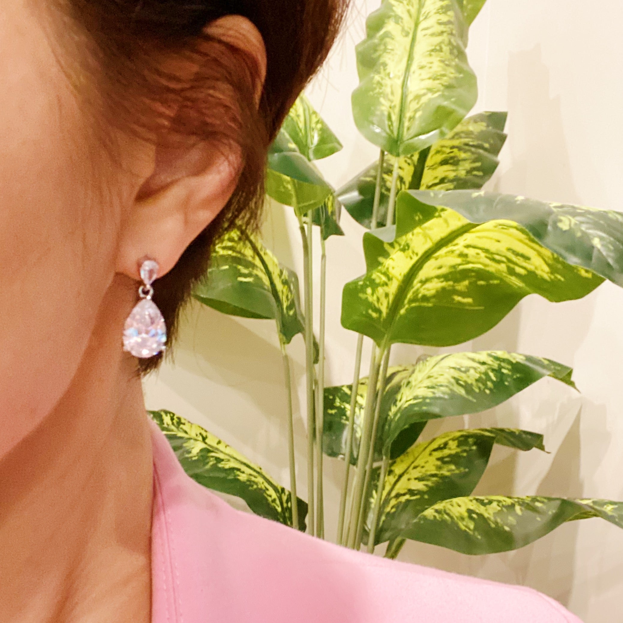 Elegant Crystal Clear Teardrop Earrings featuring sparkling cubic zirconia stones in a chic design.