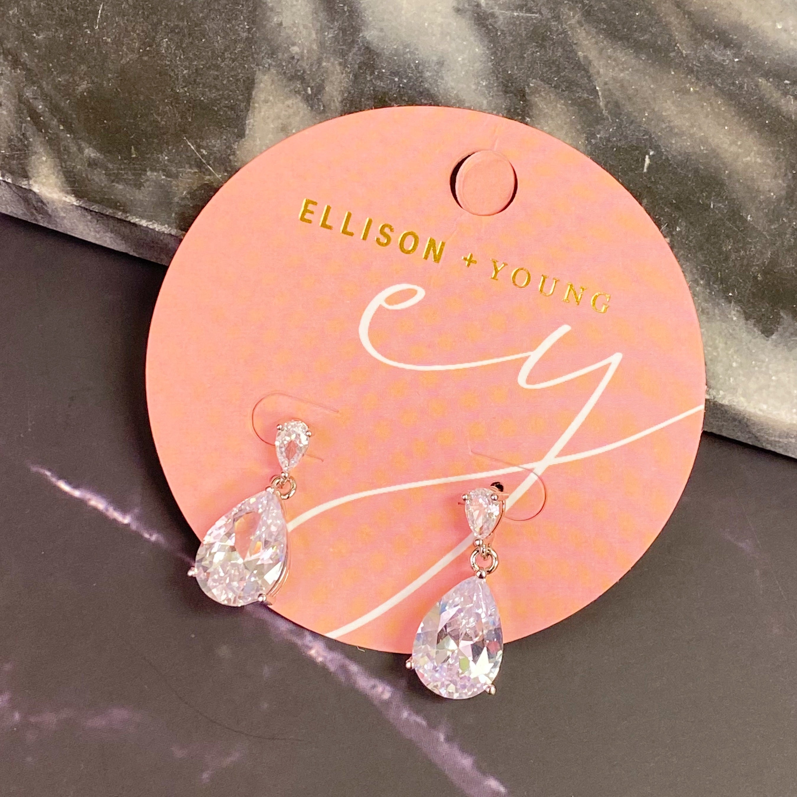 Elegant Crystal Clear Teardrop Earrings featuring sparkling cubic zirconia stones in a chic design.