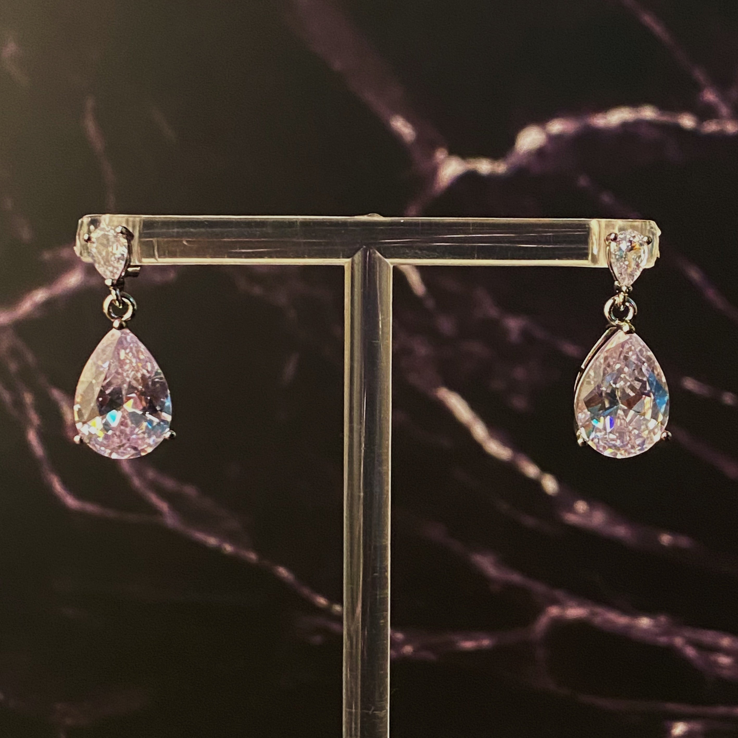 Elegant Crystal Clear Teardrop Earrings featuring sparkling cubic zirconia stones in a chic design.