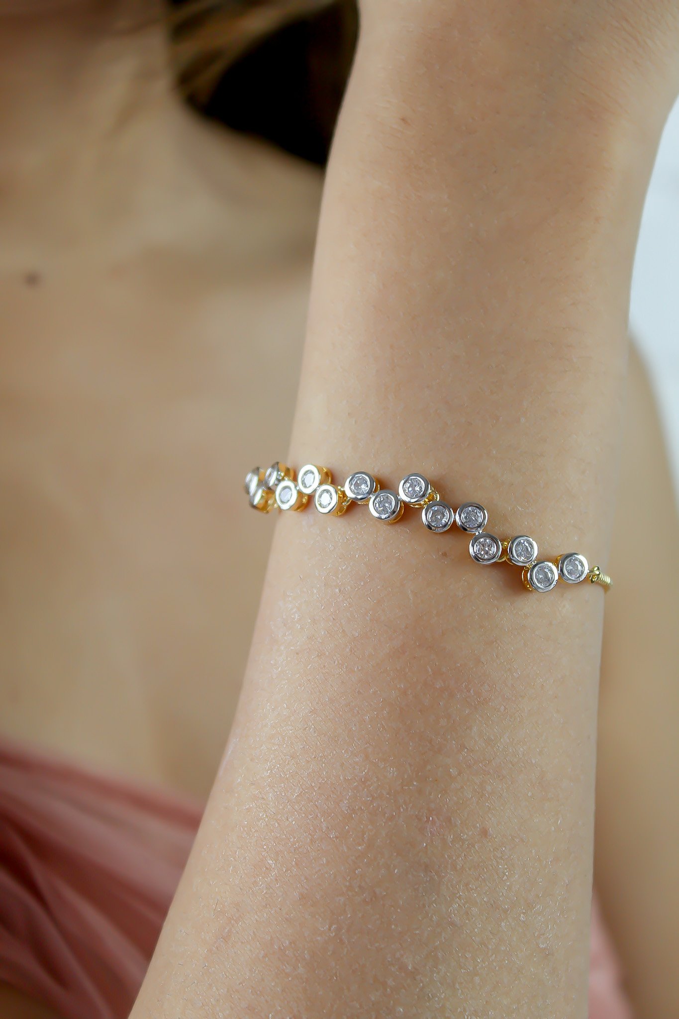 Elegant Crystal Dots Bracelet featuring 18k gold plating and sparkling authentic zircons, adjustable for a perfect fit.