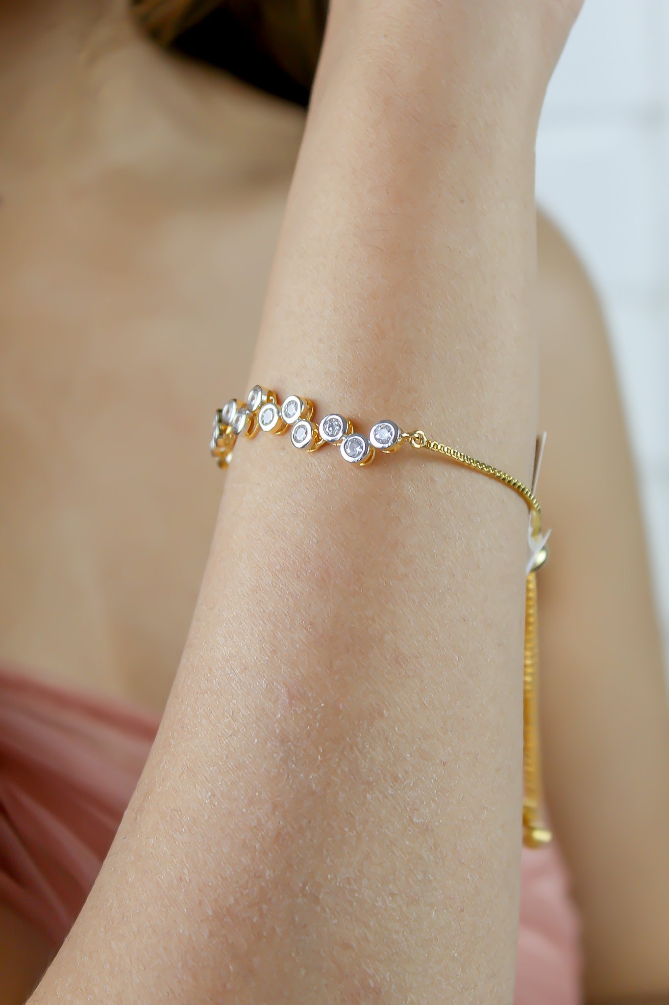 Elegant Crystal Dots Bracelet featuring 18k gold plating and sparkling authentic zircons, adjustable for a perfect fit.