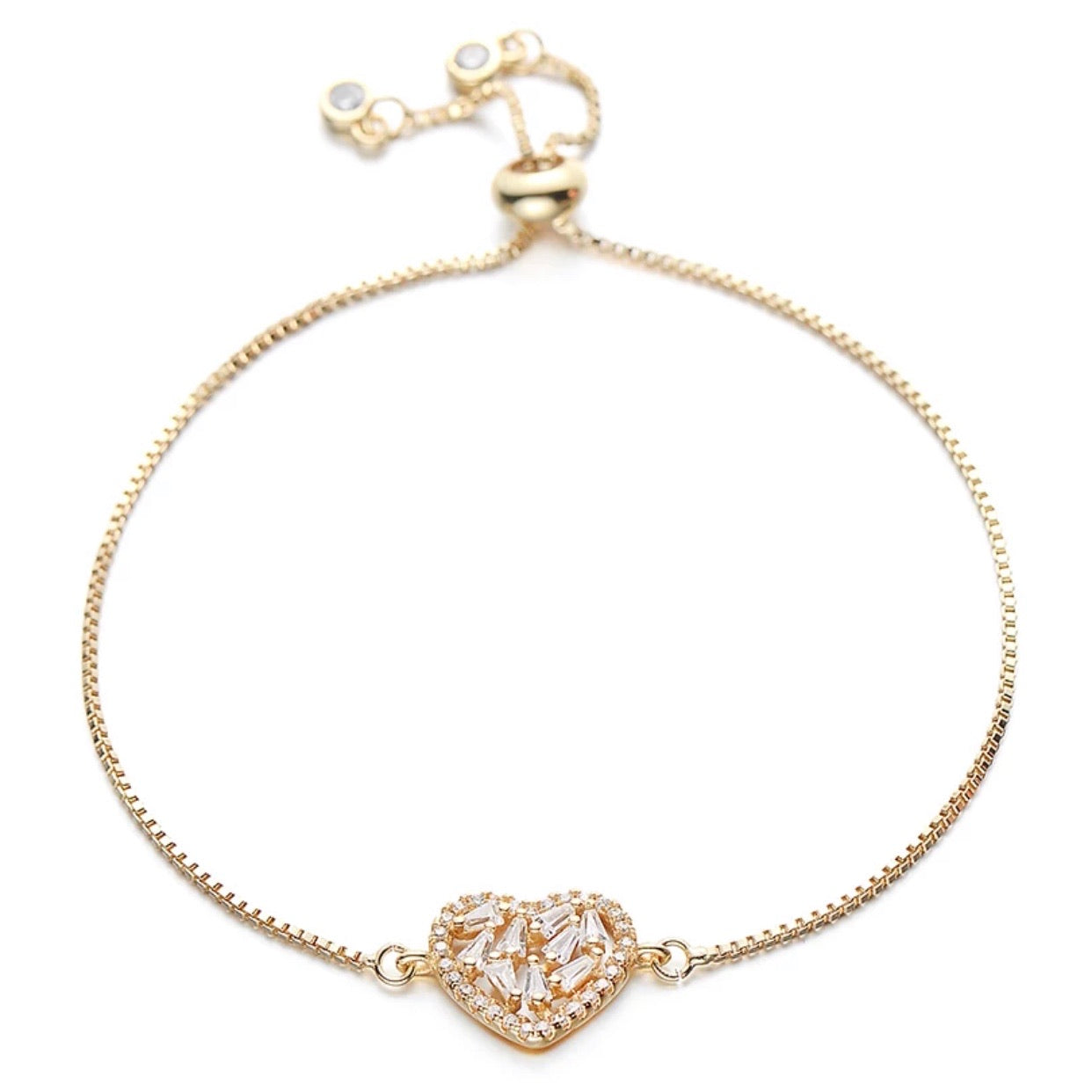 A stylish Crystal Heart Adjustable Bracelet in gold finish, featuring a sparkling crystal heart centerpiece, adjustable for all wrist sizes.