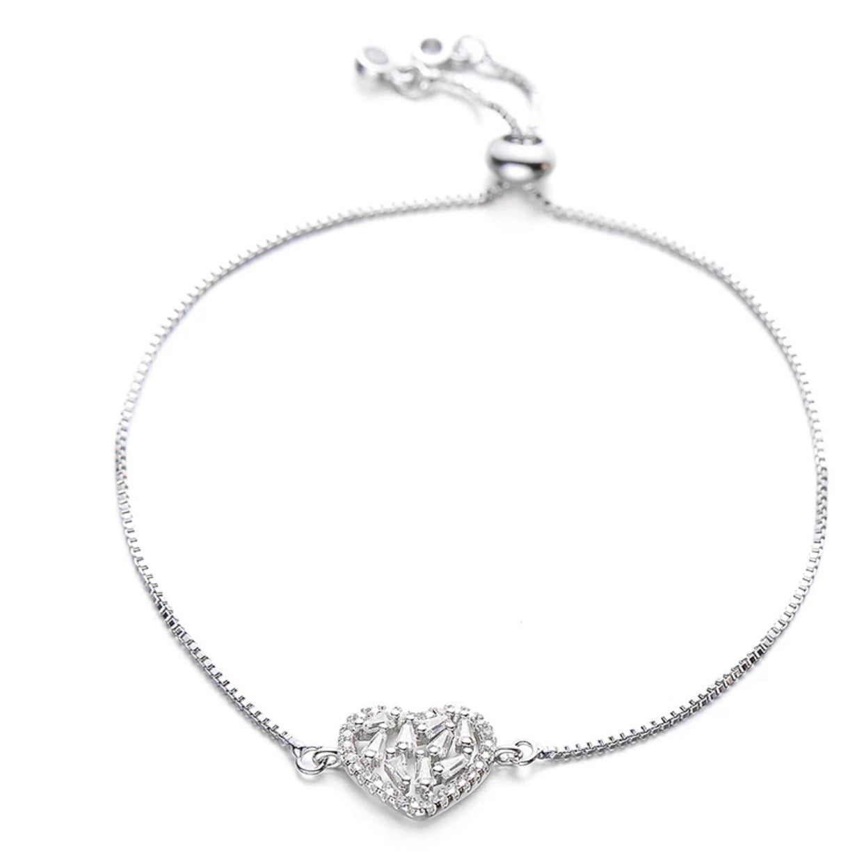 A stylish Crystal Heart Adjustable Bracelet in gold finish, featuring a sparkling crystal heart centerpiece, adjustable for all wrist sizes.