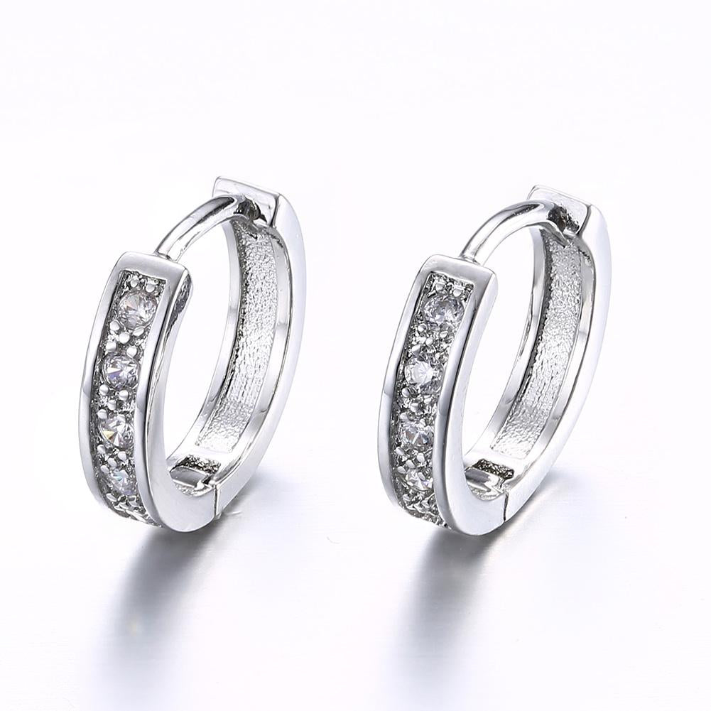 Elegant Crystal Huggie Earring in White Gold Plated, showcasing its shiny finish and comfortable design.