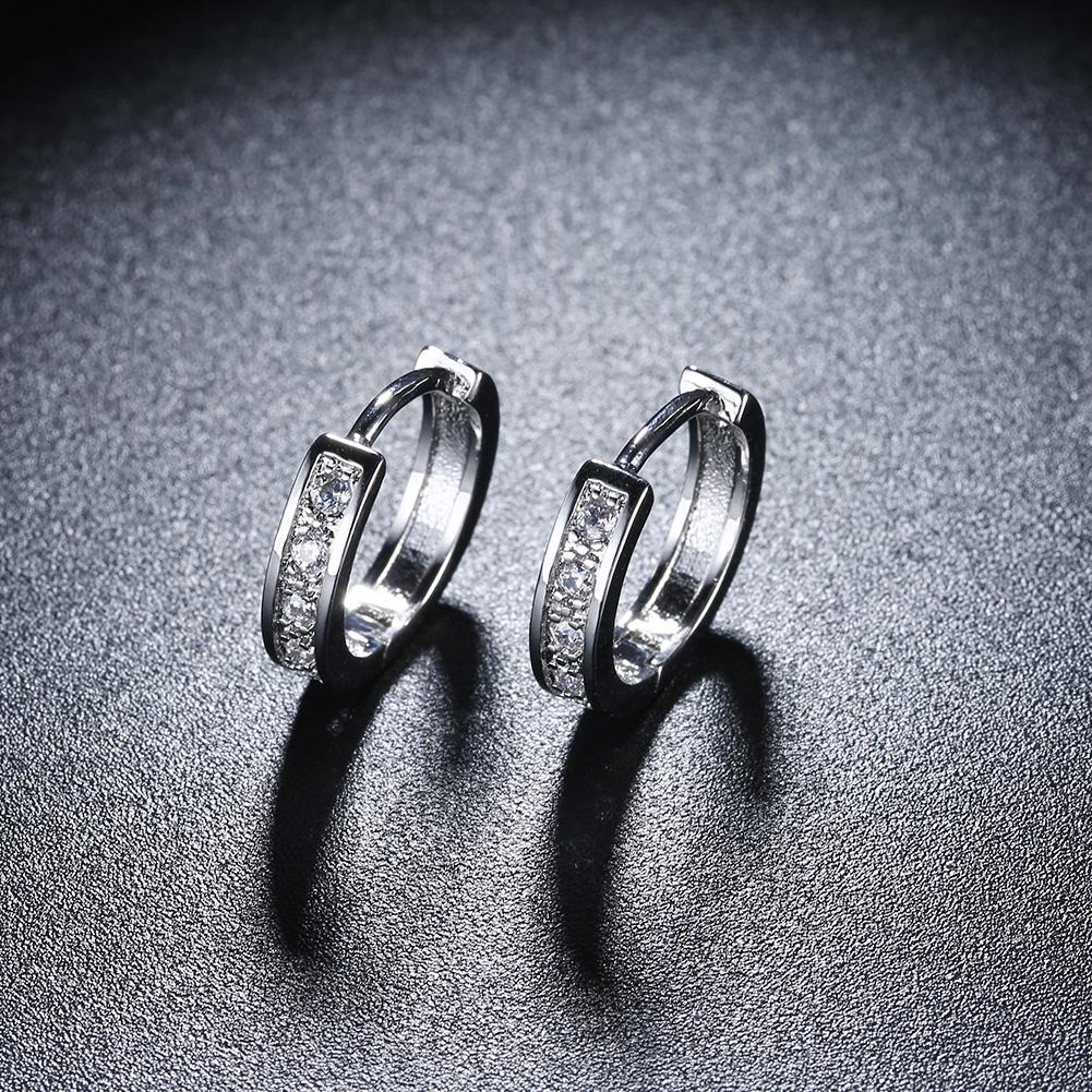 Elegant Crystal Huggie Earring in White Gold Plated, showcasing its shiny finish and comfortable design.