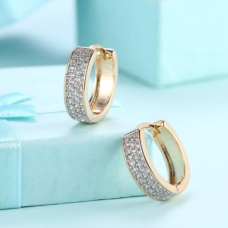 A pair of elegant Crystal Micro Pav'e Classic Huggies in 18K gold plating, featuring sparkling crystals and a butterfly backing.