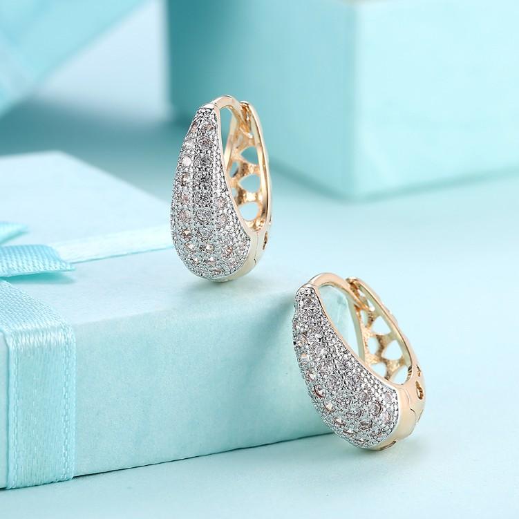 Elegant Crystal Micro-Pav'e Pear Shaped Teardrop Huggies in 18K Gold, showcasing sparkling crystals and a butterfly backing.