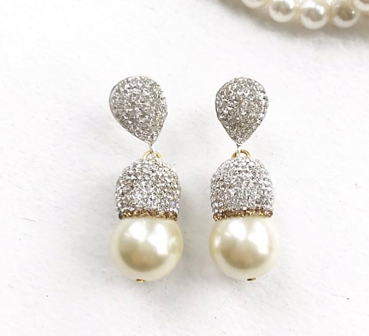 Elegant CRYSTAL Pearl Drop Earrings featuring shimmering white pearls and vintage-inspired cubic zirconia accents in a gold-plated setting.