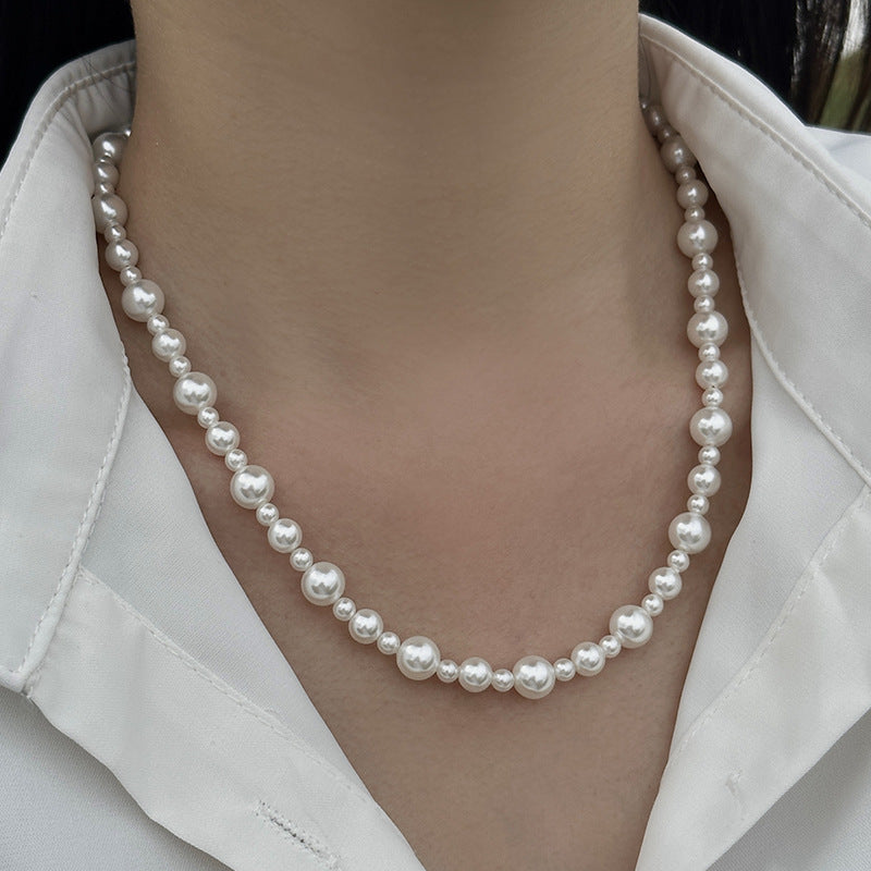 Elegant Crystal Pearl Hand-Knotted Necklace featuring oversized artificial pearls with French hand-knotting technique.