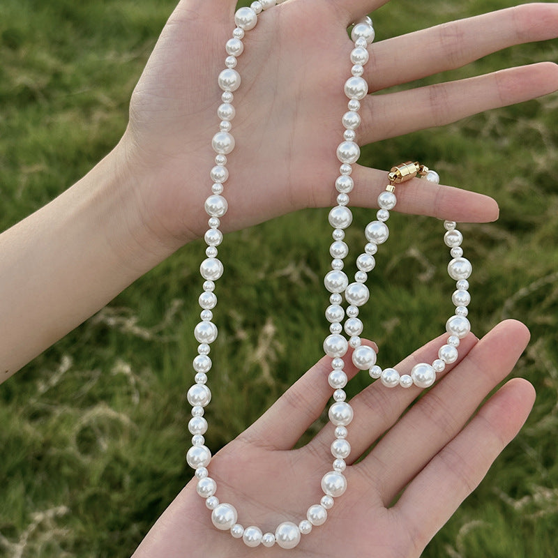 Elegant Crystal Pearl Hand-Knotted Necklace featuring oversized artificial pearls with French hand-knotting technique.