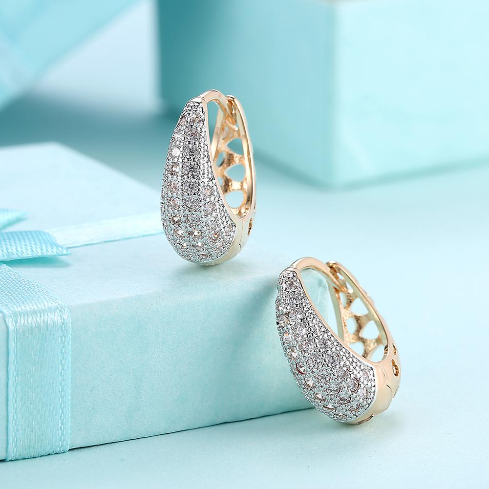 Elegant Crystals 18mm Pave Heart Filigree Teardrop Huggie Earrings in gold plating, featuring sparkling crystals and a comfortable fit.