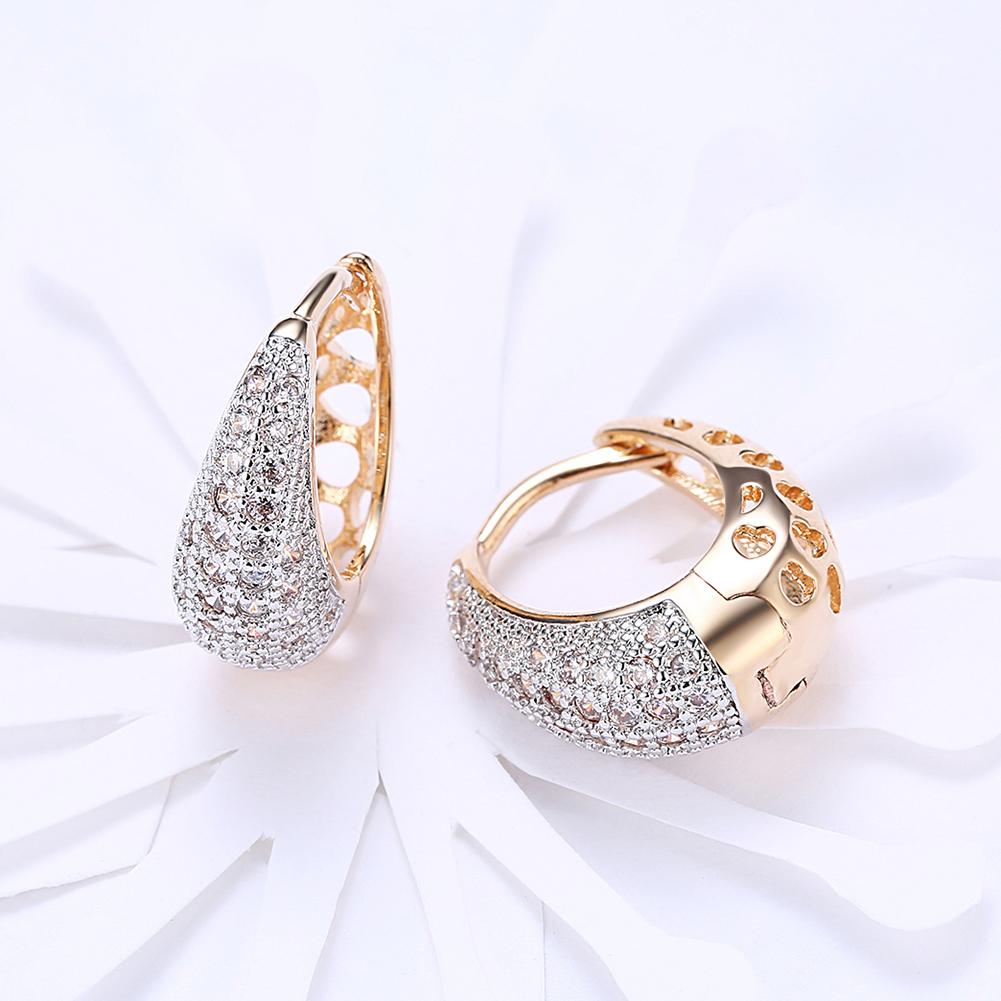 Elegant Crystals 18mm Pave Heart Filigree Teardrop Huggie Earrings in gold plating, featuring sparkling crystals and a comfortable fit.