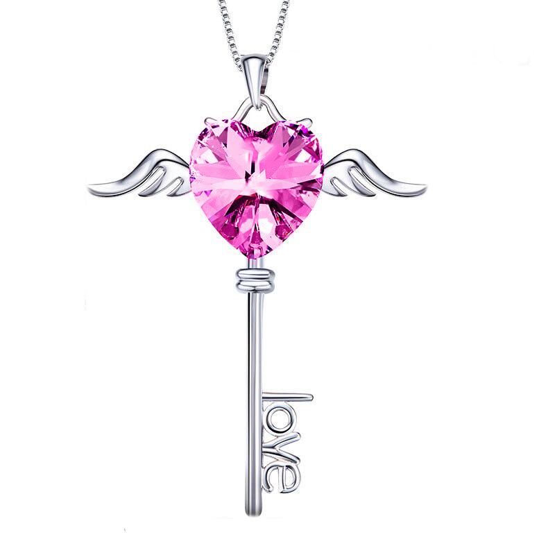 Elegant Crystals Pink Topaz Flying is the Key to Love Necklace featuring gold-plated mounts and hypoallergenic design.