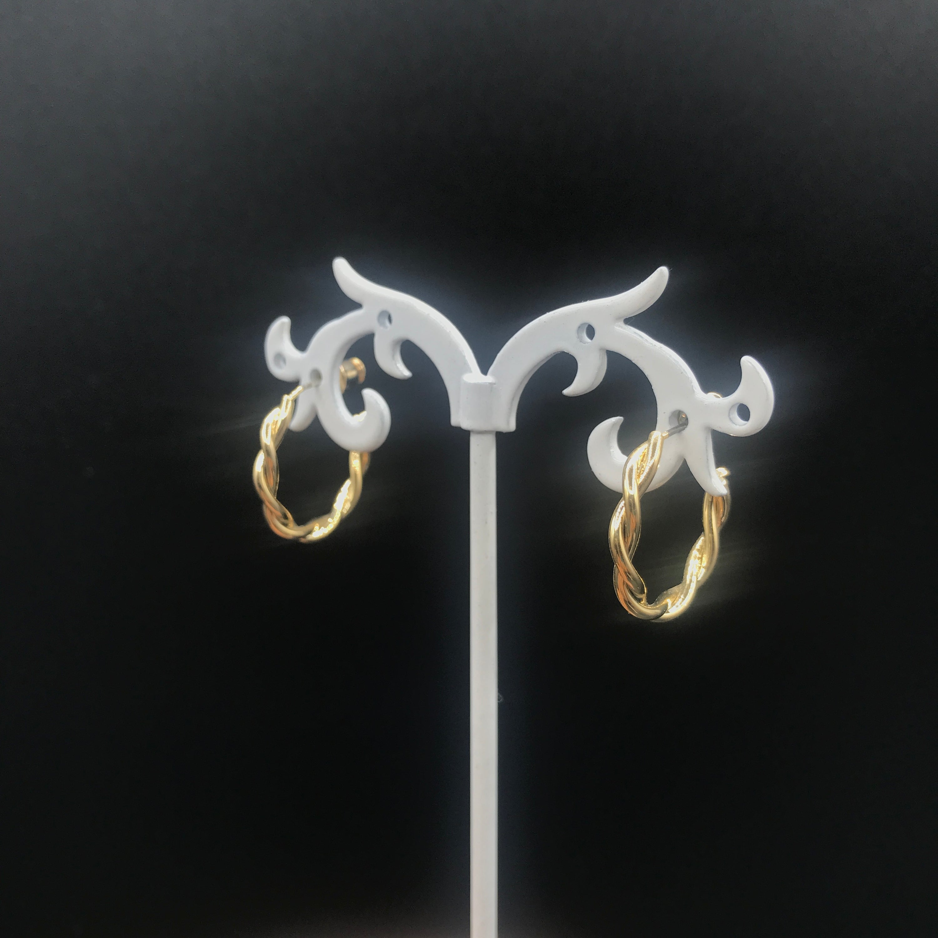 Elegant C-shaped rope earrings made from brass and s925 silver, showcasing a modern design.