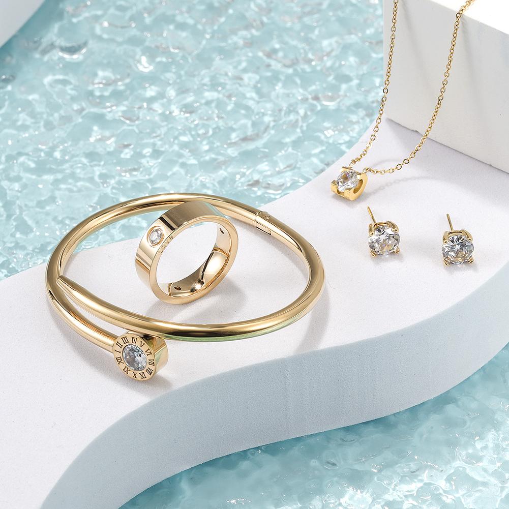 Cubic Zirconia Set featuring a necklace, bracelet, ring, and earrings, all crafted from stainless steel with sparkling cubic zirconia accents.