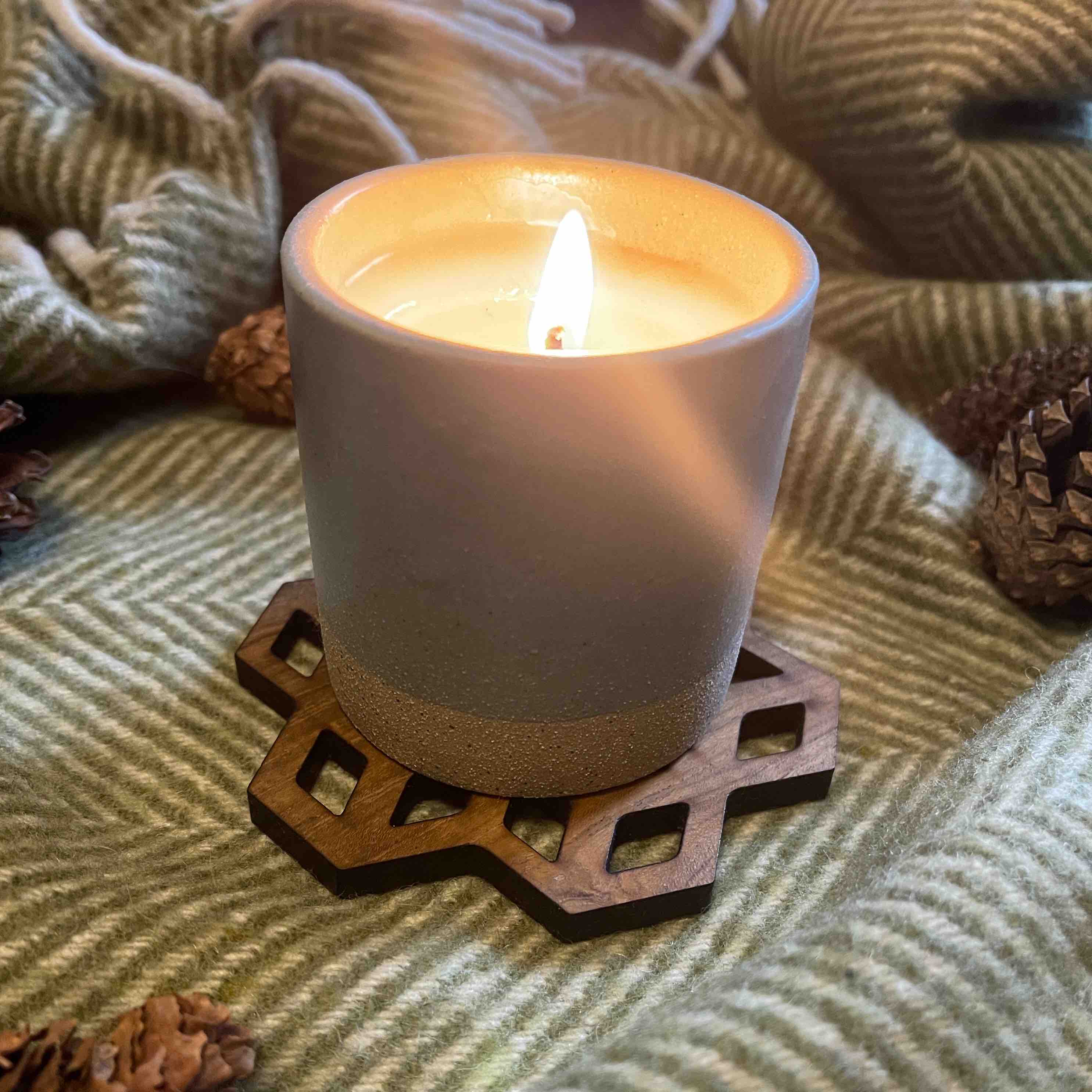 Set of Cubix Geometric Upcycled Teak Wood Coasters, showcasing unique geometric designs and natural wood grain.