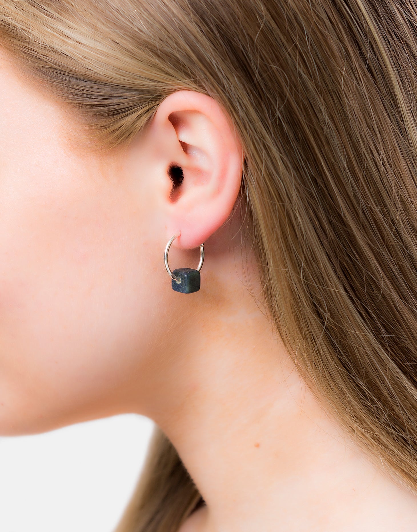 Cubo Maxi Silver Hoop Earrings featuring a tagua cube and sterling silver hoops, elegantly displayed in eco-friendly packaging.