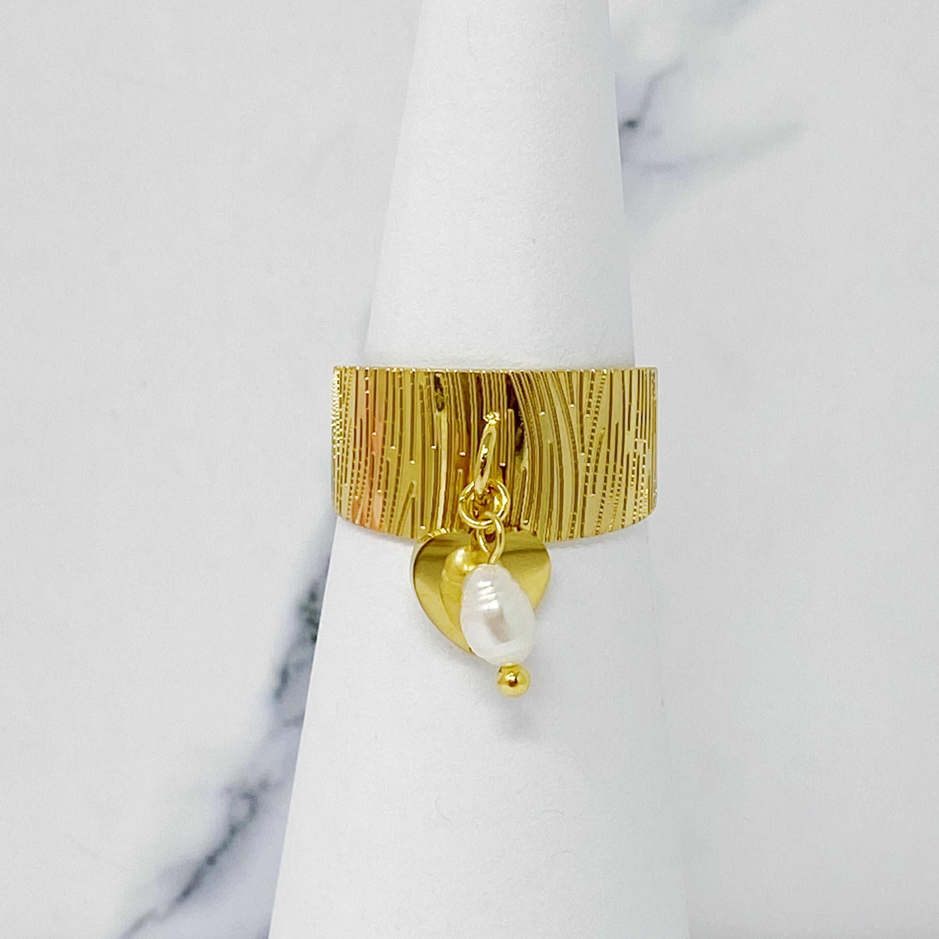 Cuff Dangle Ring featuring a dangle pearl and heart pendant, crafted from gold plated stainless steel.