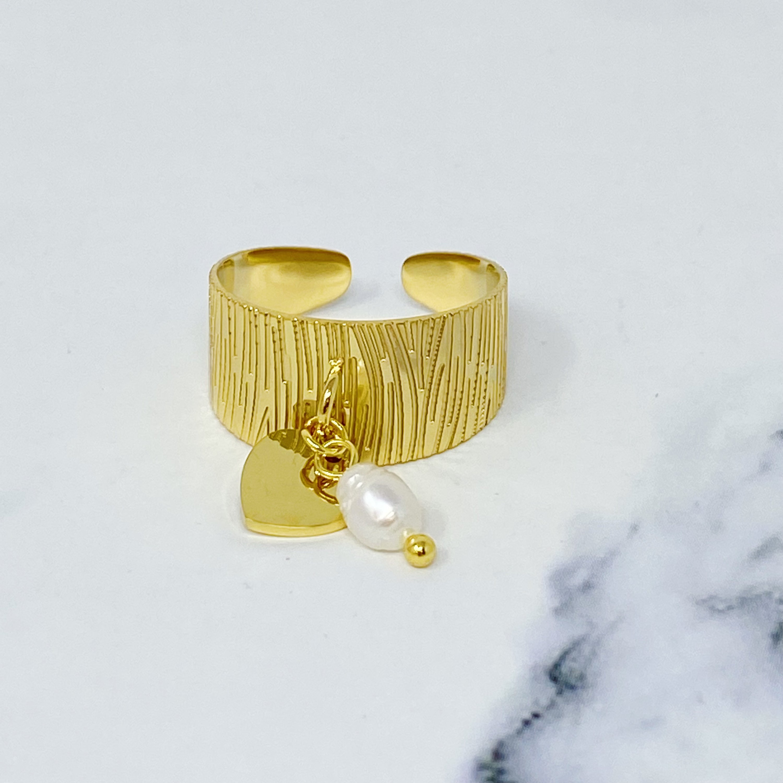 Cuff Dangle Ring featuring a dangle pearl and heart pendant, crafted from gold plated stainless steel.