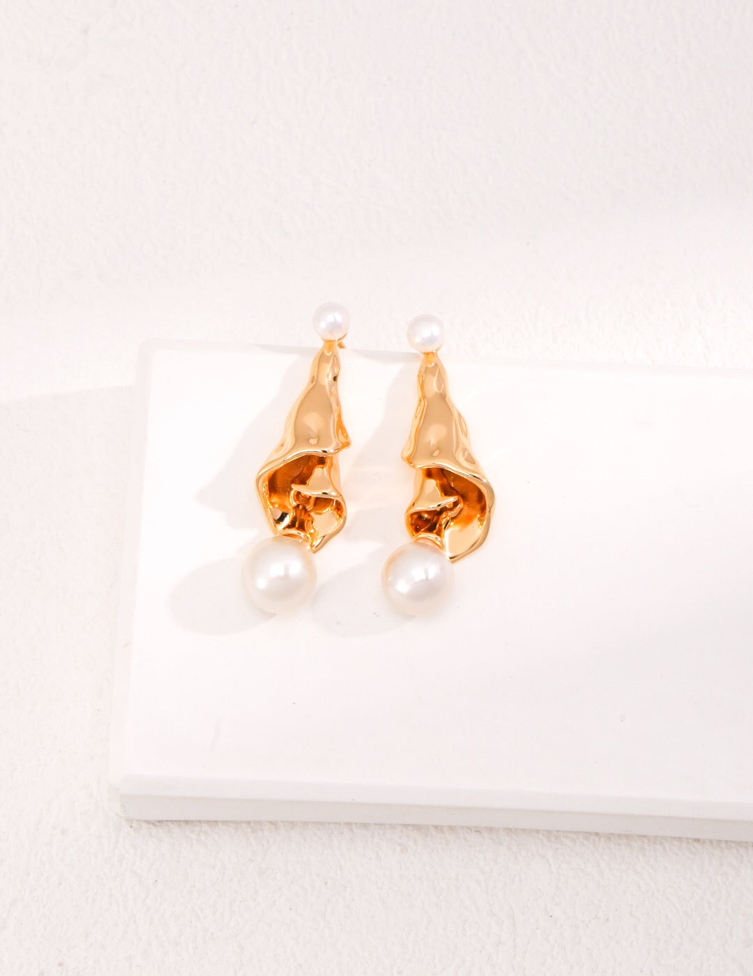 Curly Pleated Pearl Earrings featuring freshwater pearls and gold vermeil, elegantly designed for a sophisticated look.