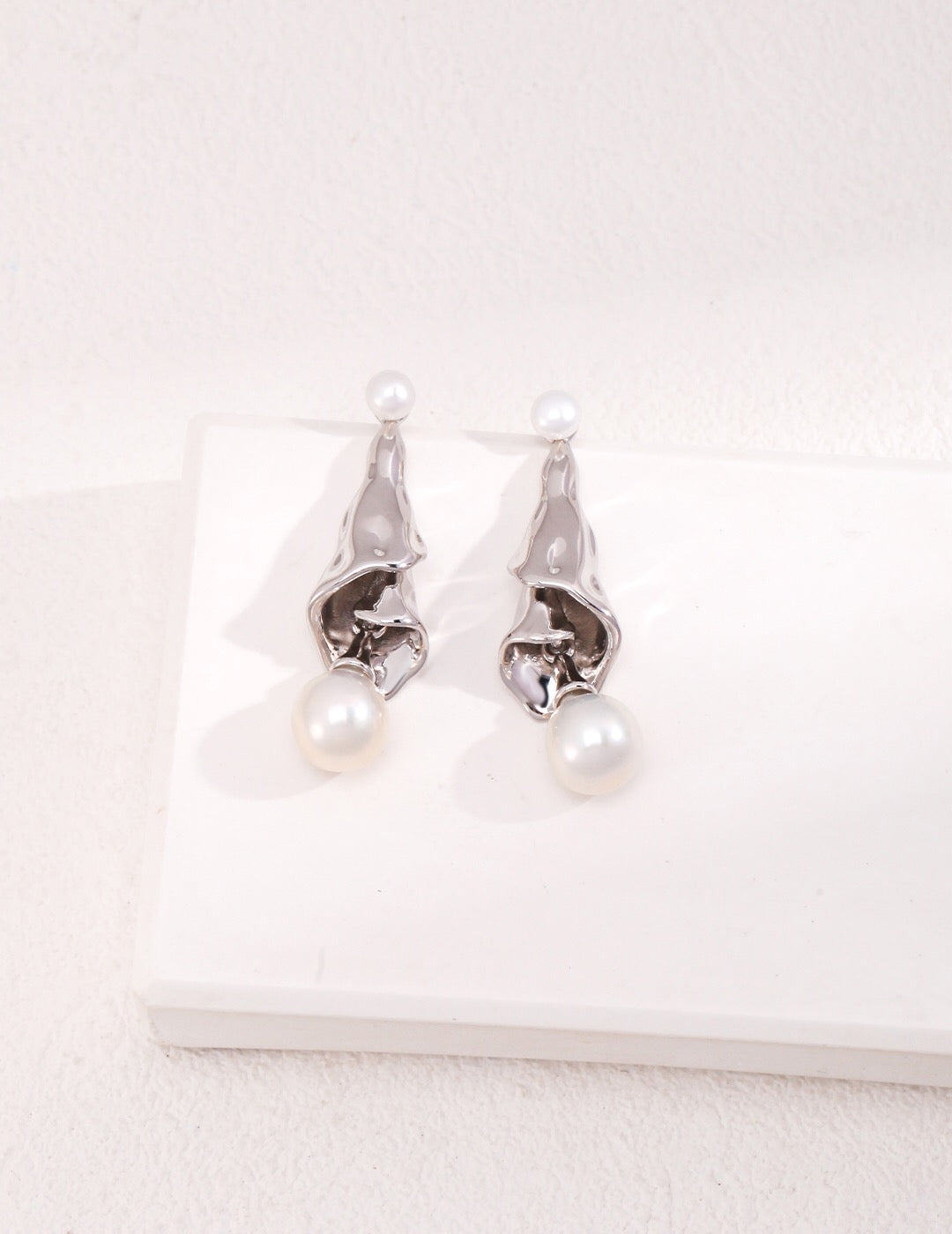 Curly Pleated Pearl Earrings featuring freshwater pearls and gold vermeil, elegantly designed for a sophisticated look.