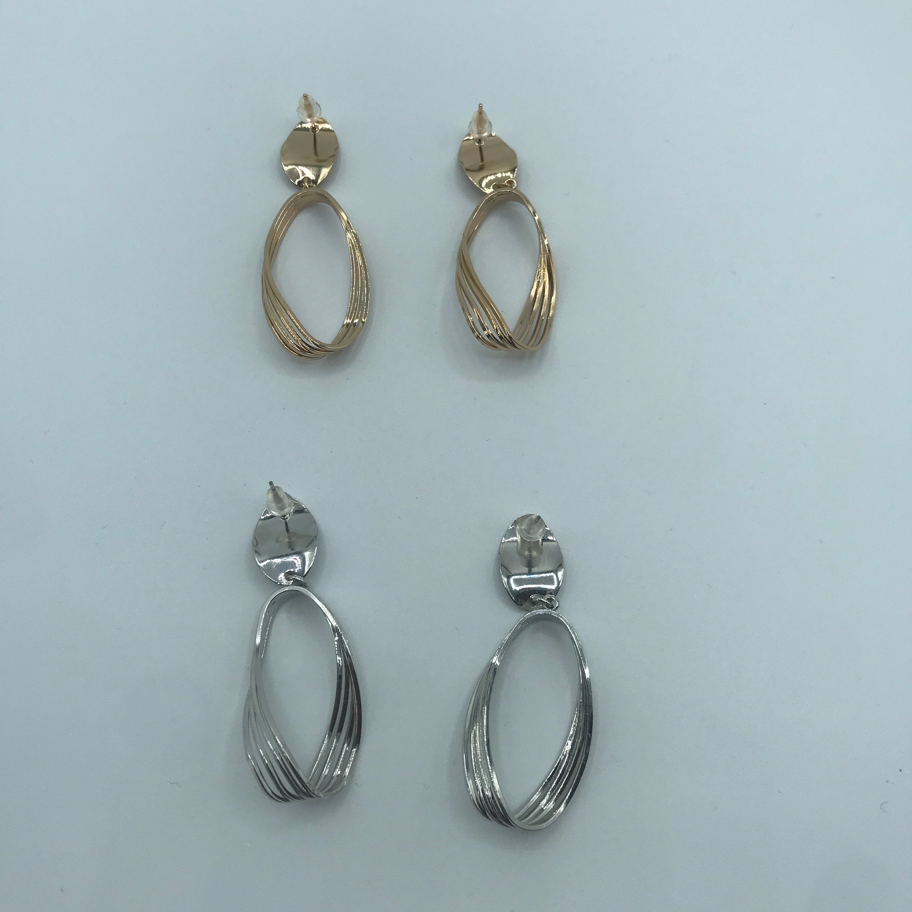 Elegant Curved Triple-lines Oval Earrings made of alloy, showcasing a modern design with a shiny finish.