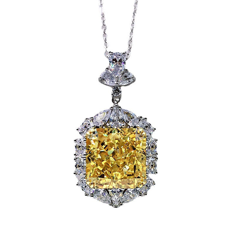 A stunning cushion cut fancy yellow citrine necklace set in 925 sterling silver with white gold accents, featuring brilliant white sapphires.