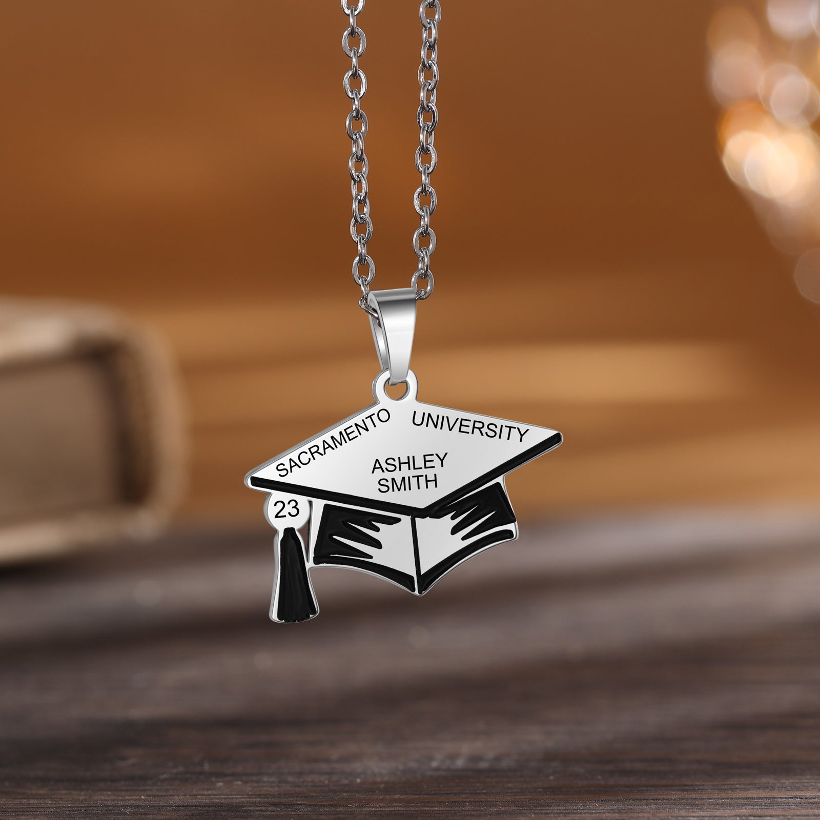 Custom Graduation Hat Necklace made of stainless steel, featuring a graduation cap charm, adjustable length, and tarnish-resistant finish.