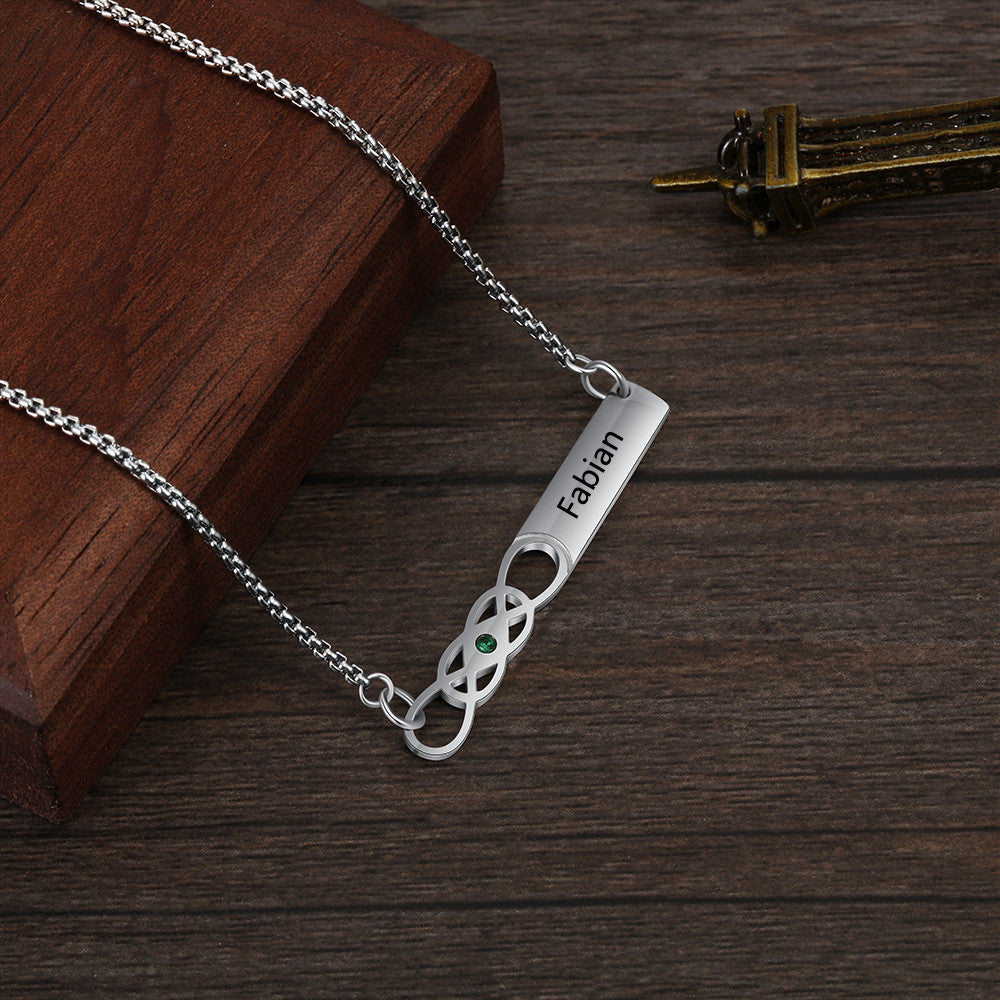 Custom Name Bar Birthstone Necklace made of stainless steel, featuring a personalized name bar and a birthstone, elegantly displayed on a soft background.