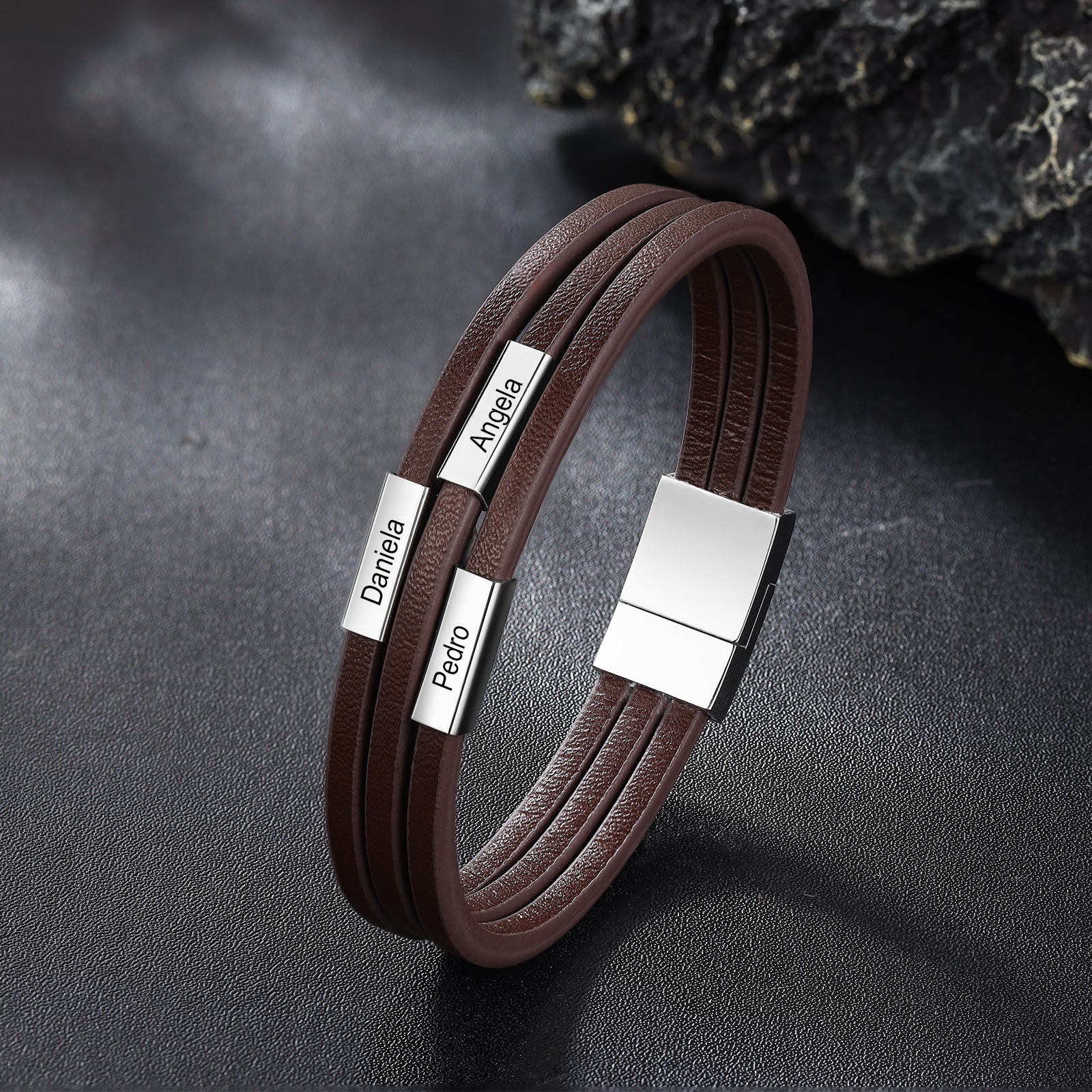 Custom Name Leather Bracelet in black with stainless steel accents, showcasing personalized name engraving.