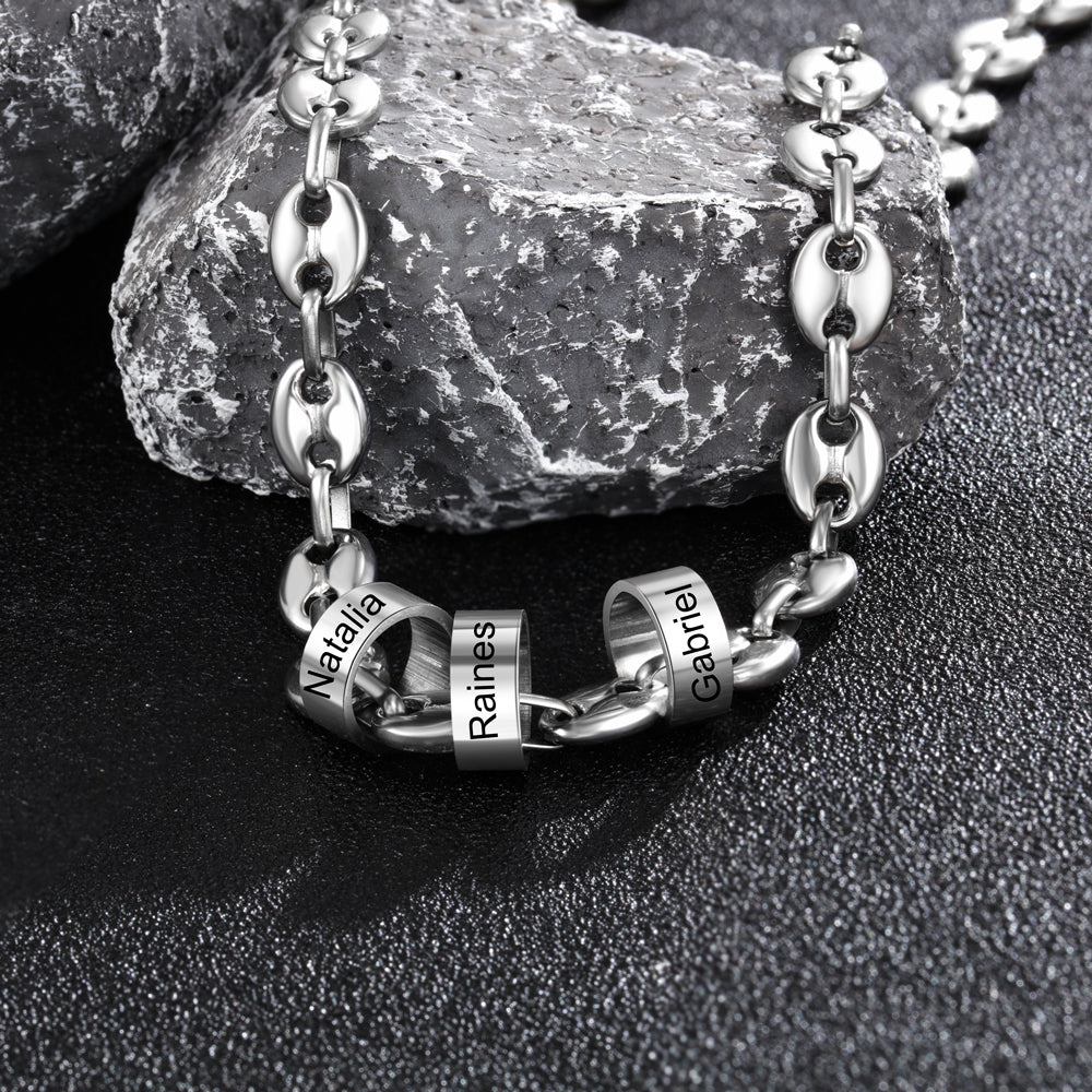 A beautiful custom stainless steel bead necklace featuring personalized name engravings, showcasing its elegant design and adjustable length.